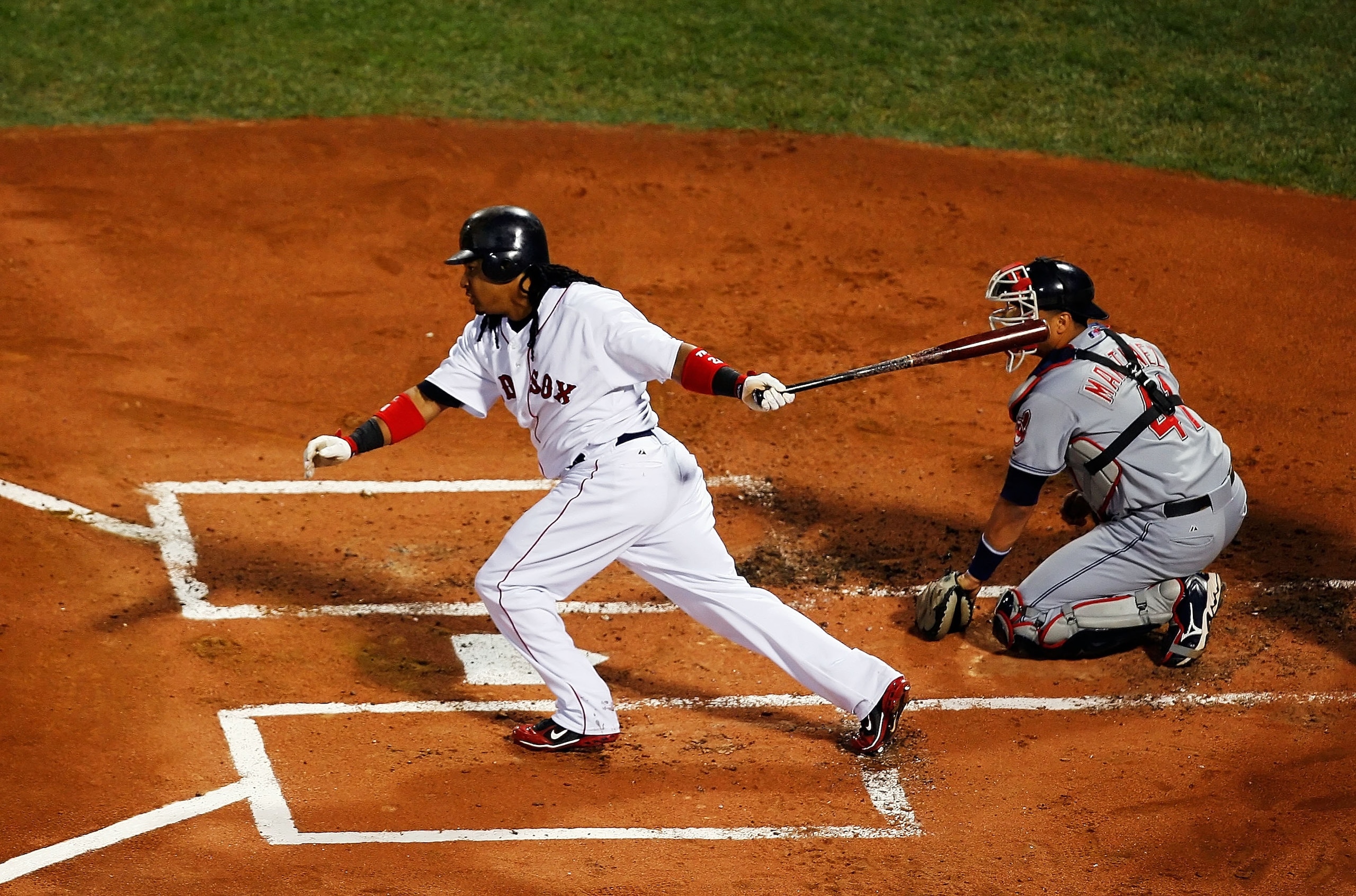 BOSTON - OCTOBER 21:  Manny Ramirez #24 of the Boston Red Sox hits an RBI single in the first inning against the Cleveland Indians in Game Seven of the American League Championship Series at Fenway Park on October 21, 2007 in Boston, Massachusetts.  (Phot