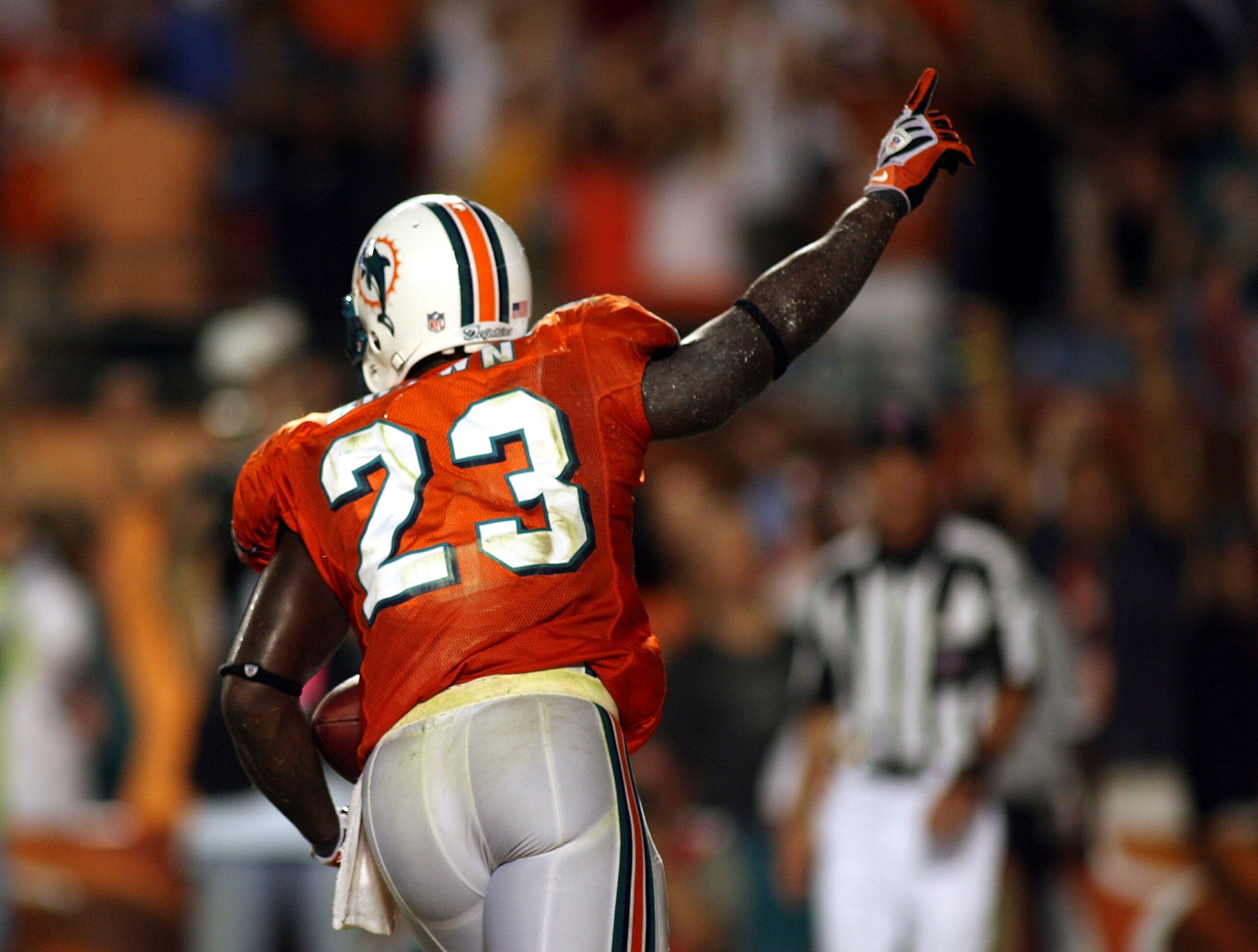 MIAMI - OCTOBER 12:  Running back Ronnie Brown #23 of the Miami Dolphins celebrates scoring the game winning touchdown against the New York Jets fans prior to their game at Land Shark Stadium on October 12, 2009 in Miami, Florida. Miami defeated New York