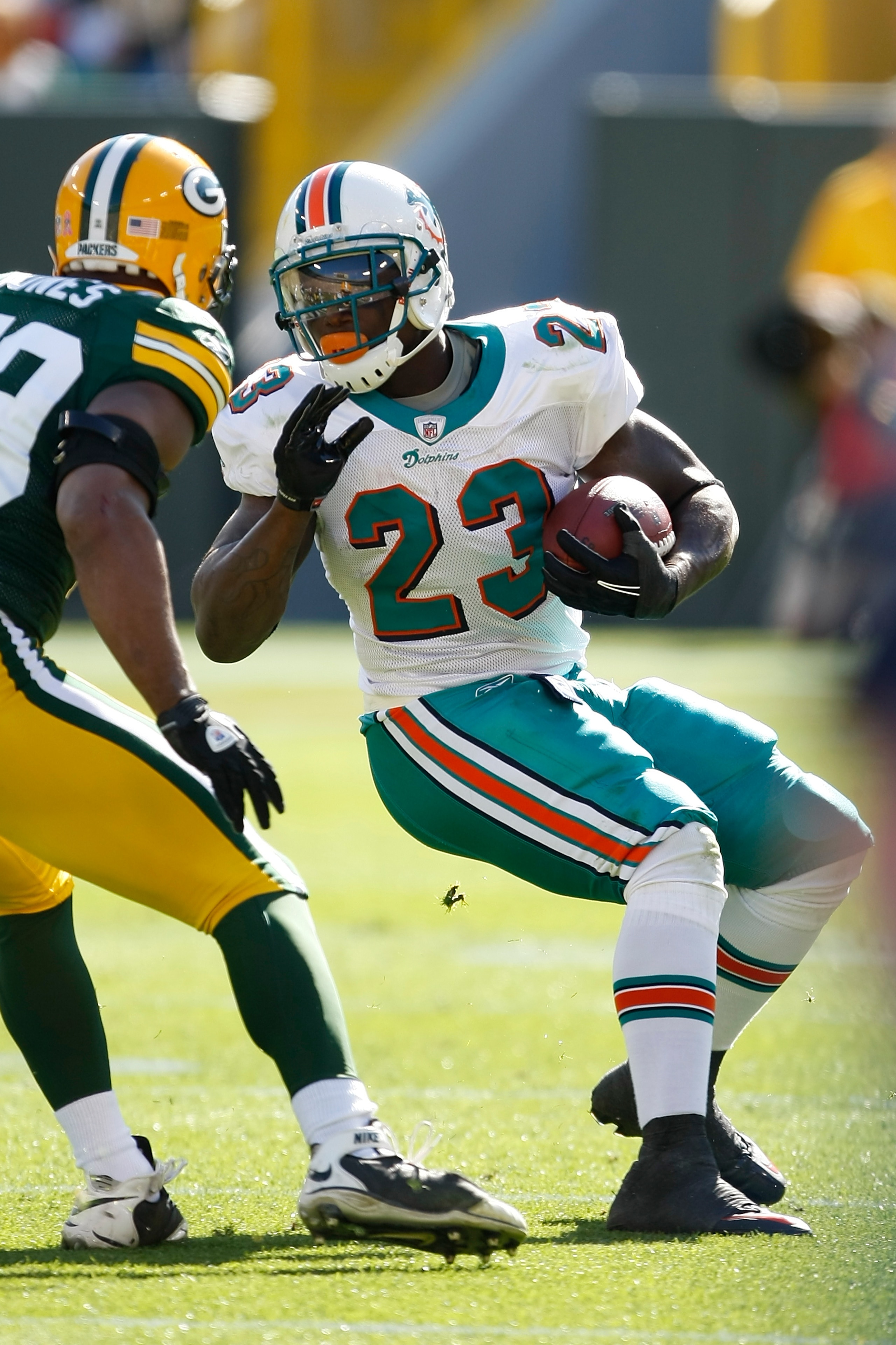GREEN BAY, WI - OCTOBER 17: Ronnie Brown #23 of the Miami Dolphins runs against the Green Bay Packers at Lambeau Field on October 17, 2010 in Green Bay, Wisconsin. (Photo by Scott Boehm/Getty Images)