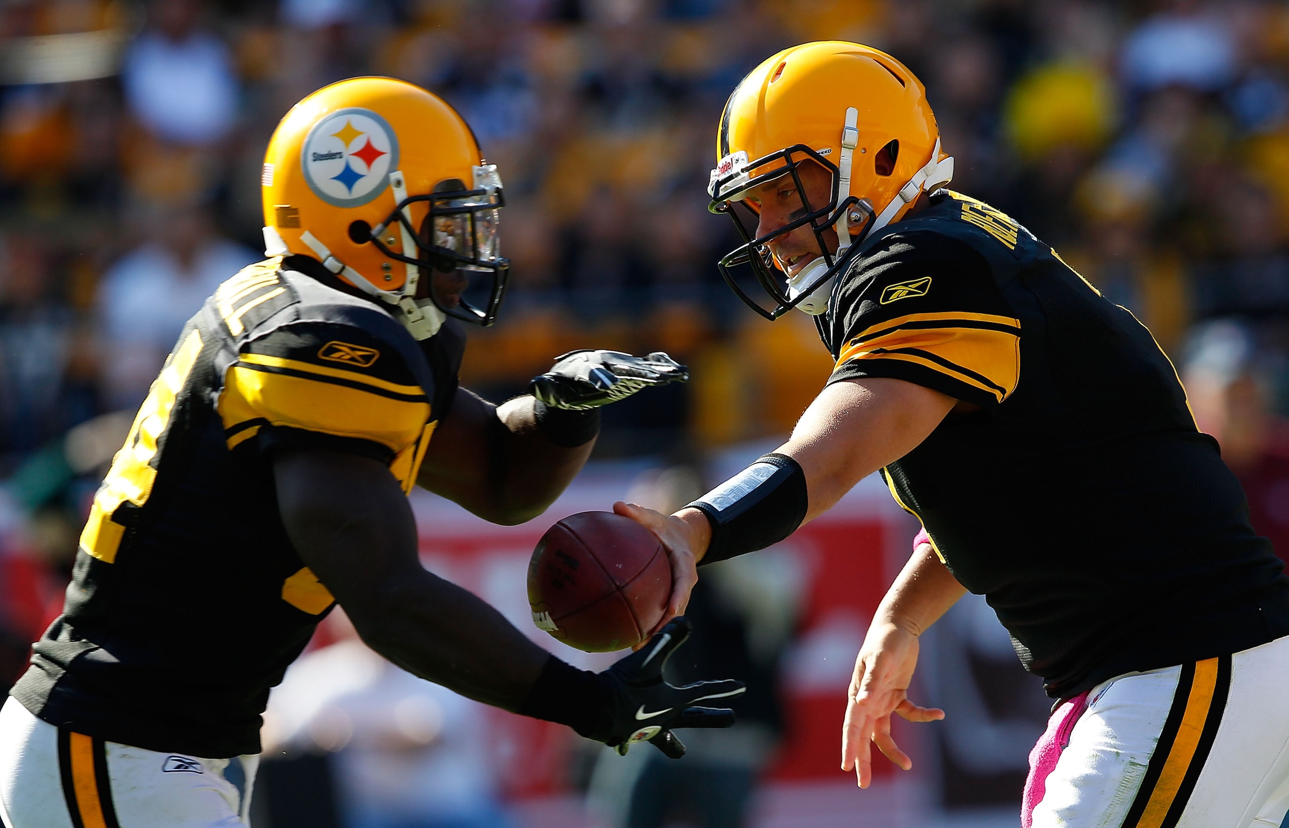 PITTSBURGH - OCTOBER 17: Ben Roethlisberger #7 of the Pittsburgh Steelers hands the ball off to teammate Rashard Mendenhall #34 during the game against the Cleveland Browns on October 17, 2010 at Heinz Field in Pittsburgh, Pennsylvania.  (Photo by Jared W