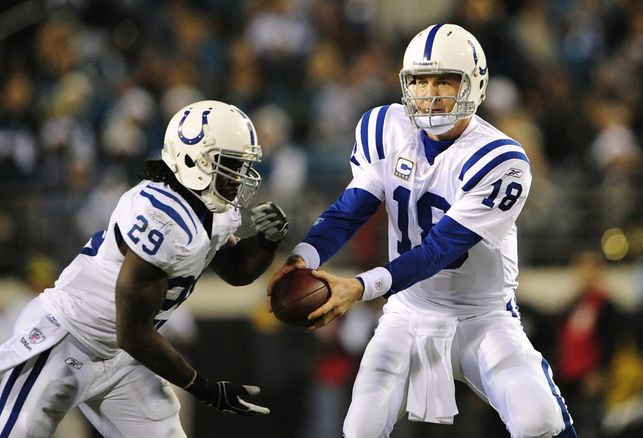 JACKSONVILLE, FL - DECEMBER 17:  Peyton Manning #18 of the Indianapolis Colts fakes a hand off to Joseph Addai #29 against the Jacksonville Jaguars at Jacksonville Municipal Stadium on December 17, 2009 in Jacksonville, Florida.  (Photo by Sam Greenwood/G