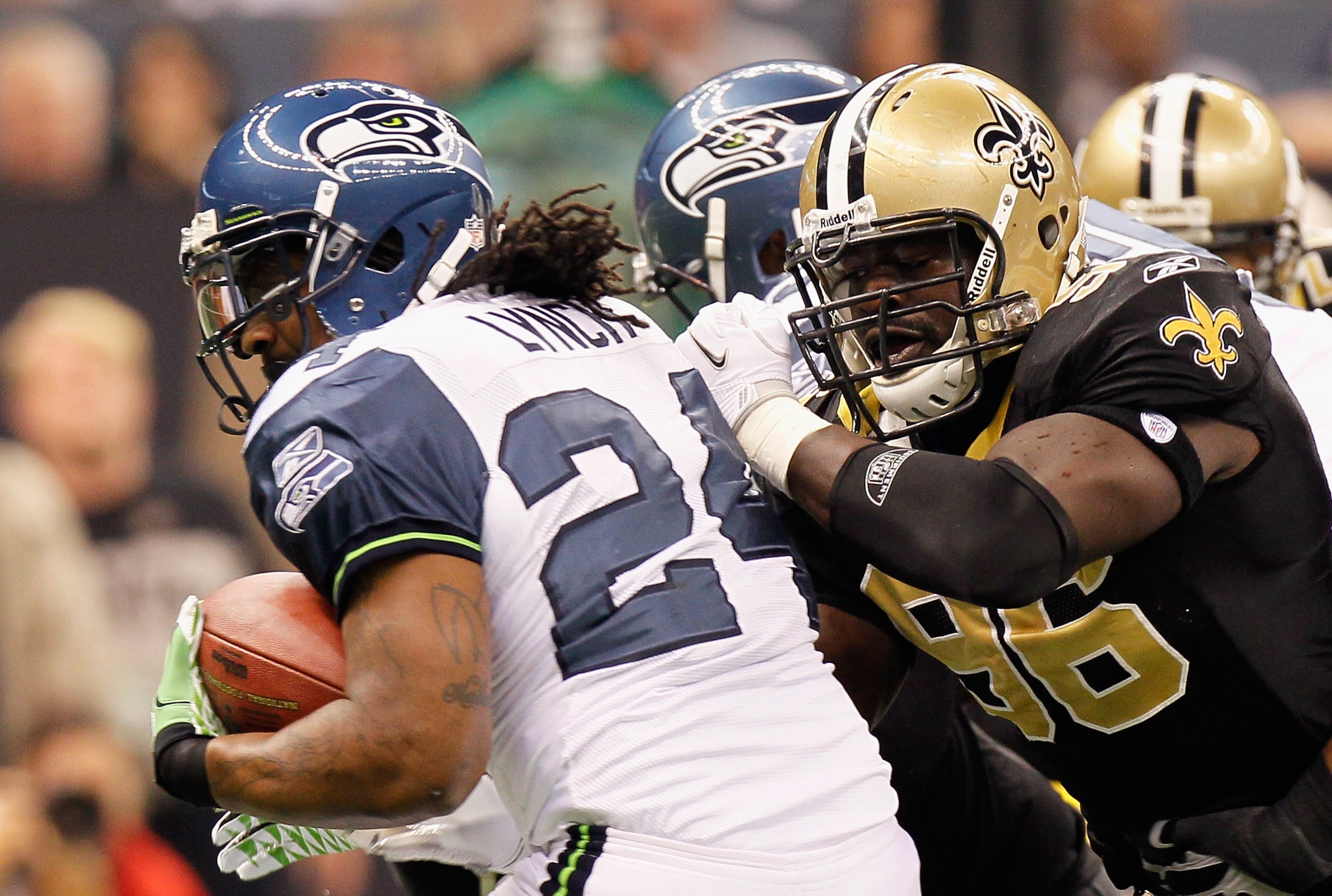 NEW ORLEANS - NOVEMBER 21: Marshawn Lynch #24 of the Seattle Seahawks against Alex Brown #96 of the New Orleans Saints at Louisiana Superdome on November 21, 2010 in New Orleans, Louisiana. (Photo by Kevin C. Cox/Getty Images) NEW ORLEANS - NOVEMBER 21: Marshawn Lynch #24 of the Seattle Seahawks against Alex Brown #96 of the New Orleans Saints at Louisiana Superdome on November 21, 2010 in New Orleans, Louisiana. (Photo by Kevin C. Cox/Getty Images)