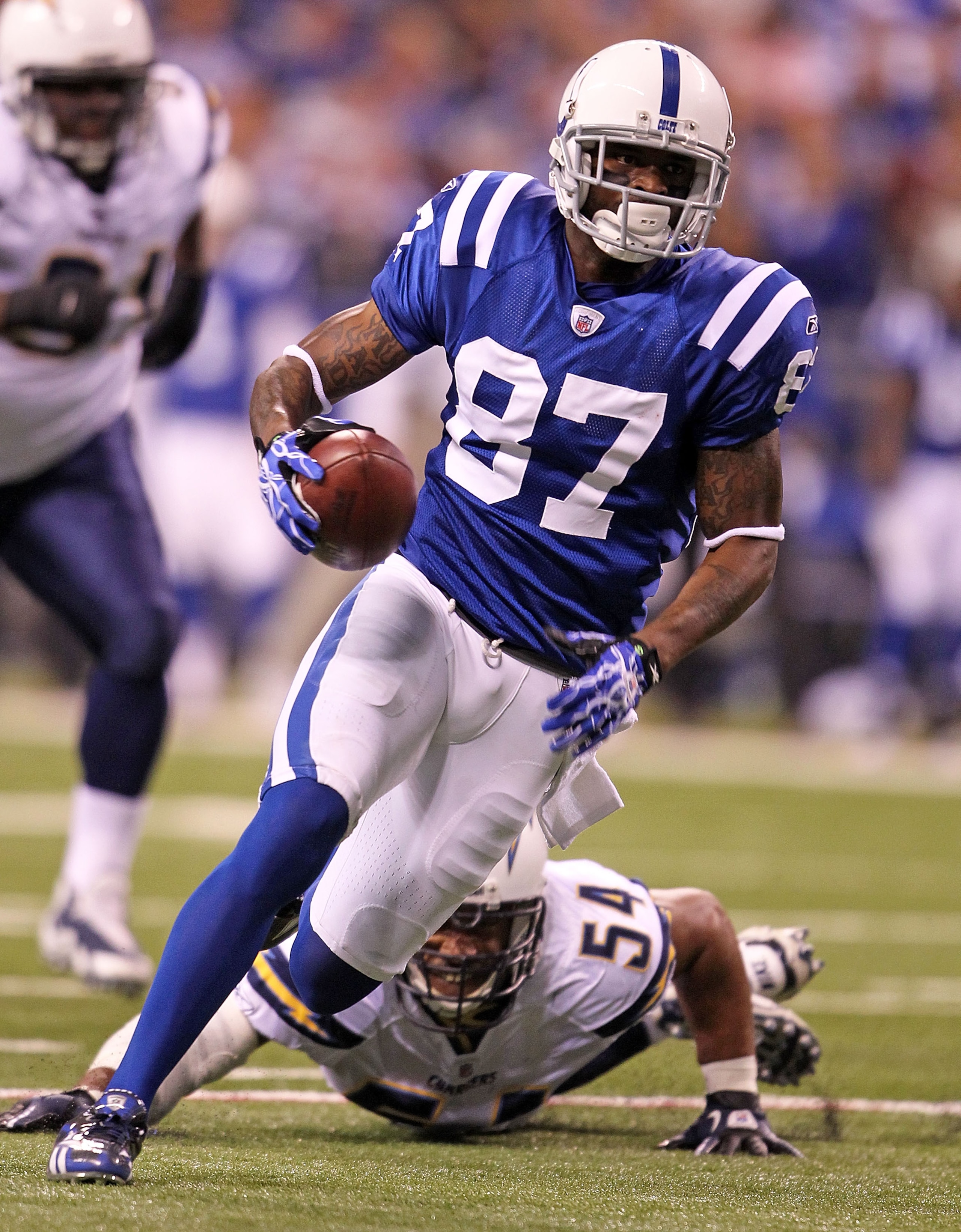 INDIANAPOLIS - NOVEMBER 28: Reggie Wayne #87 of the Indianapolis Colts runs with the ball during the NFL game against the San Diego Chargers at Lucas Oil Stadium on November 28, 2010 in Indianapolis, Indiana.  (Photo by Andy Lyons/Getty Images)