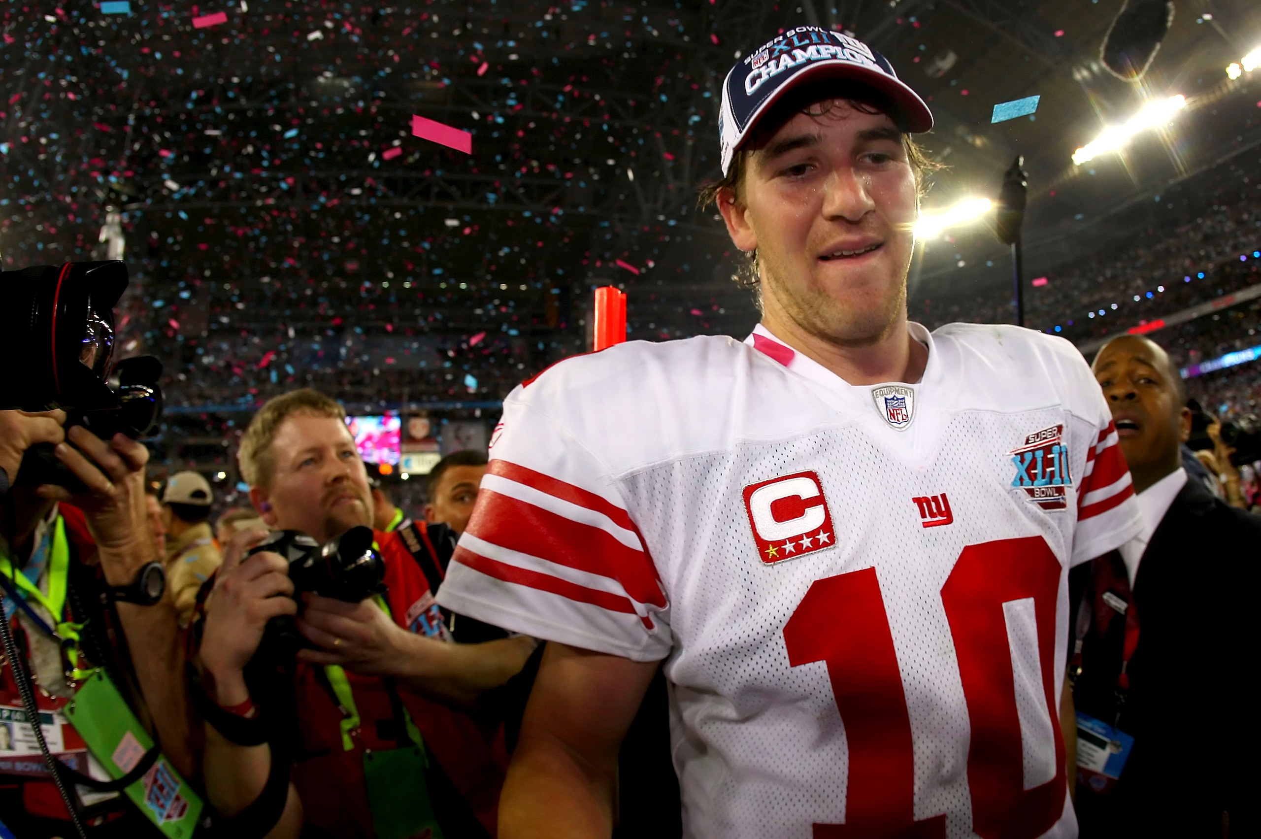 GLENDALE, AZ - FEBRUARY 03:  Quarterback Eli Manning #10 of the New York Giants walks off the field after the Giants defeated the New England Patriots 17-14 during Super Bowl XLII on February 3, 2008 at the University of Phoenix Stadium in Glendale, Arizo