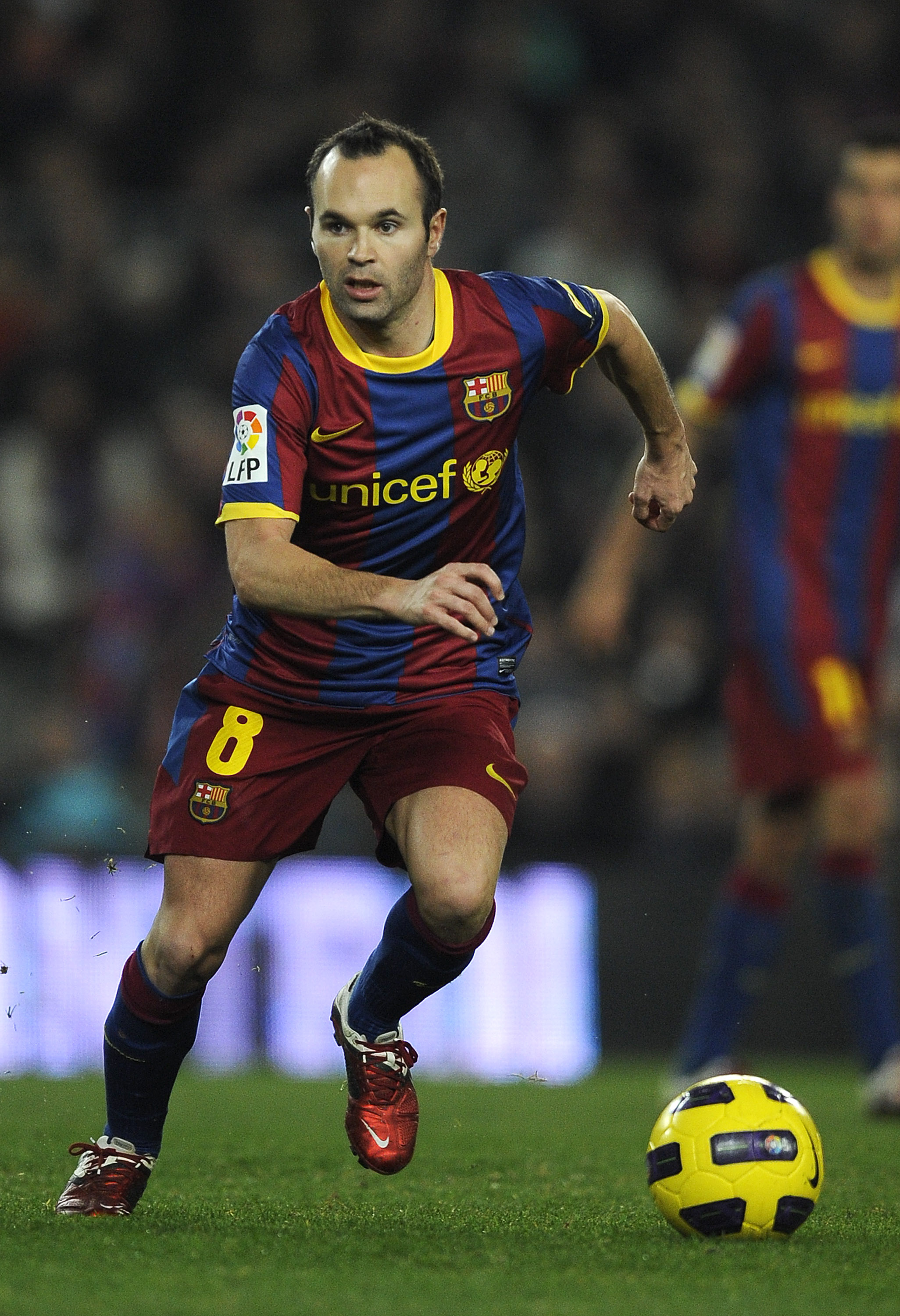 BARCELONA, SPAIN - JANUARY 02:  Andres Iniesta of Barcelona runs with the ball during the La Liga match between Barcelona and Levante UD at Camp Nou on January 2, 2011 in Barcelona, Spain. Barcelona won 2-1.  (Photo by David Ramos/Getty Images)