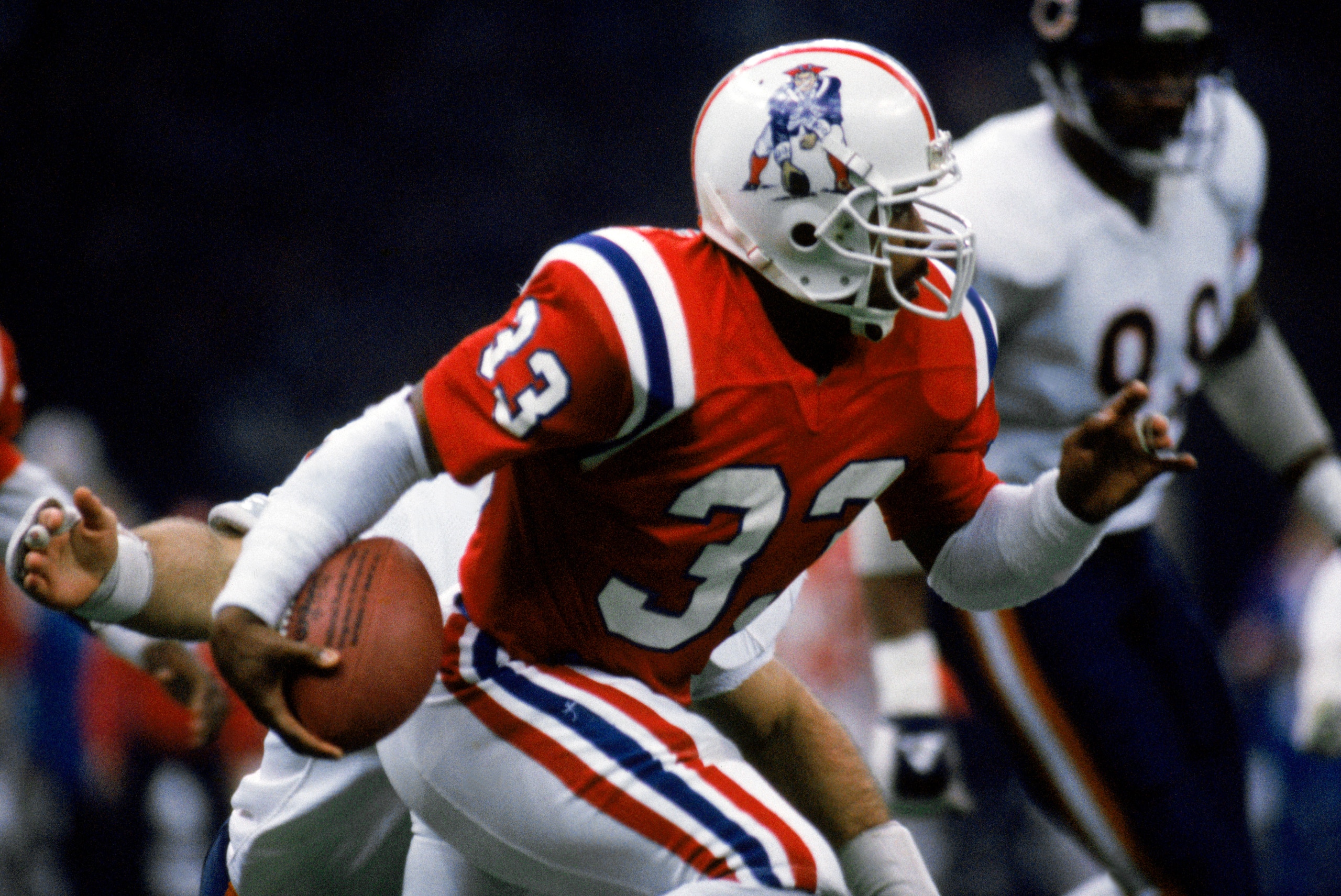 NEW ORLEANS - JANUARY 26:  Running back Tony Collins #33 of the New England Patriots carries the ball during Superbowl XX against the Chicago Bears at the Louisiana Superdome on January 26, 1986 in New Orleans, Louisiana.  The Bears defeated the Pats 46-1