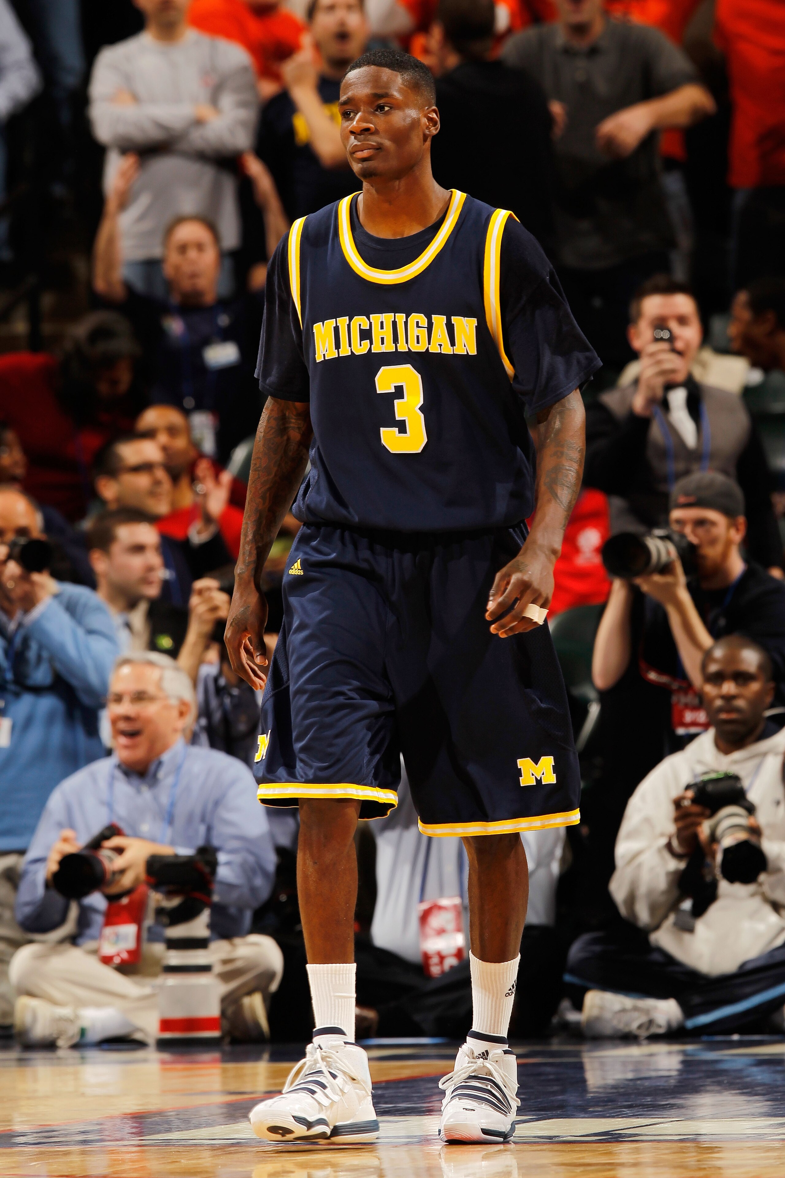 INDIANAPOLIS - MARCH 12: Guard Manny Harris #3 of the Michigan Wolverines reacts after losing in the final seconds of their quarterfinal game against the Ohio State Buckeyes in the Big Ten Men's Basketball Tournament at Conseco Fieldhouse on March 12, 20 INDIANAPOLIS - MARCH 12: Guard Manny Harris #3 of the Michigan Wolverines reacts after losing in the final seconds of their quarterfinal game against the Ohio State Buckeyes in the Big Ten Men's Basketball Tournament at Conseco Fieldhouse on March 12, 20