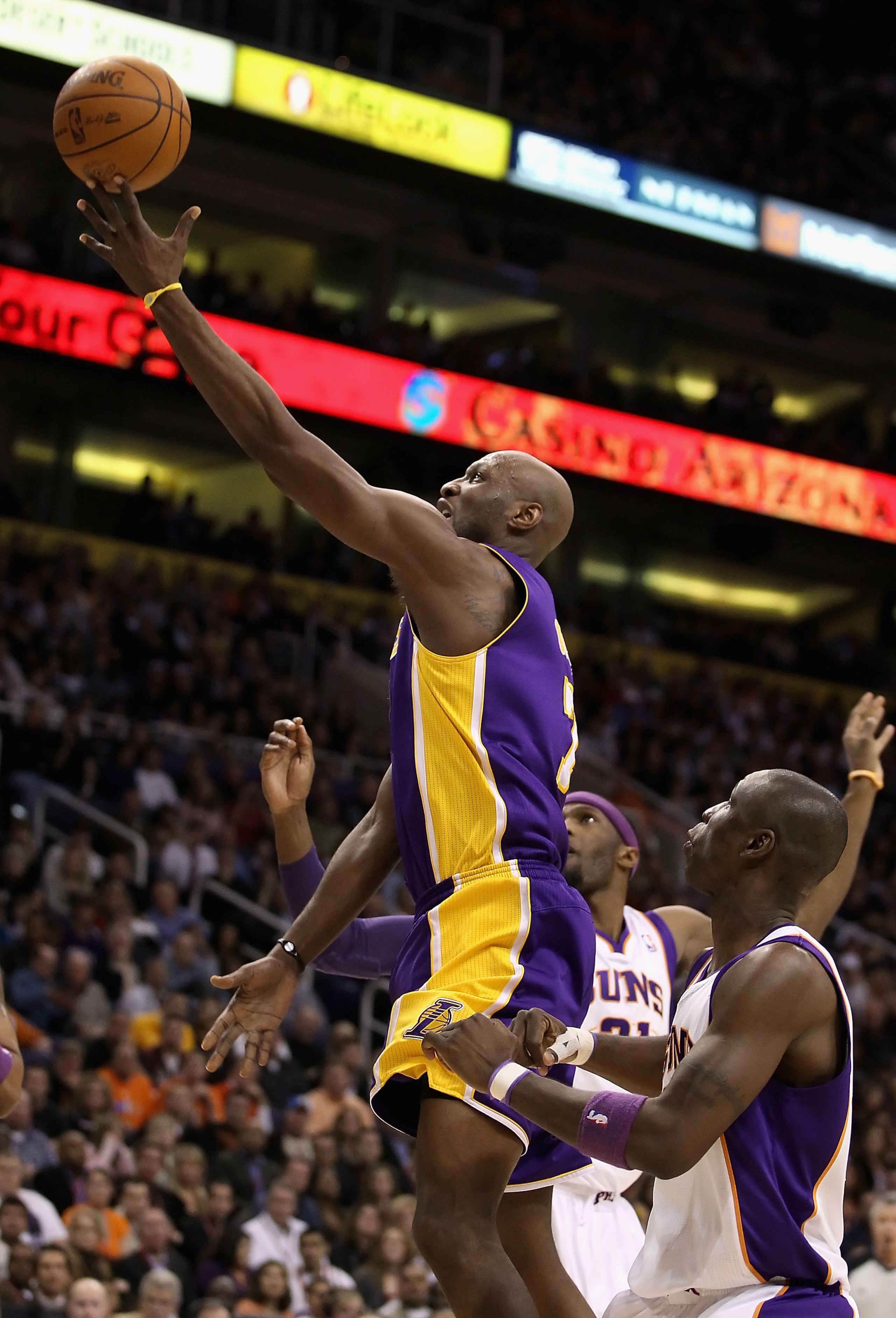PHOENIX - JANUARY 05:  Lamar Odom #7 of the Los Angeles Lakers lays up a shot against the Phoenix Suns during the NBA game at US Airways Center on December 23, 2011 in Phoenix, Arizona. The Lakers defeated the Suns 99-95. NOTE TO USER: User expressly ackn
