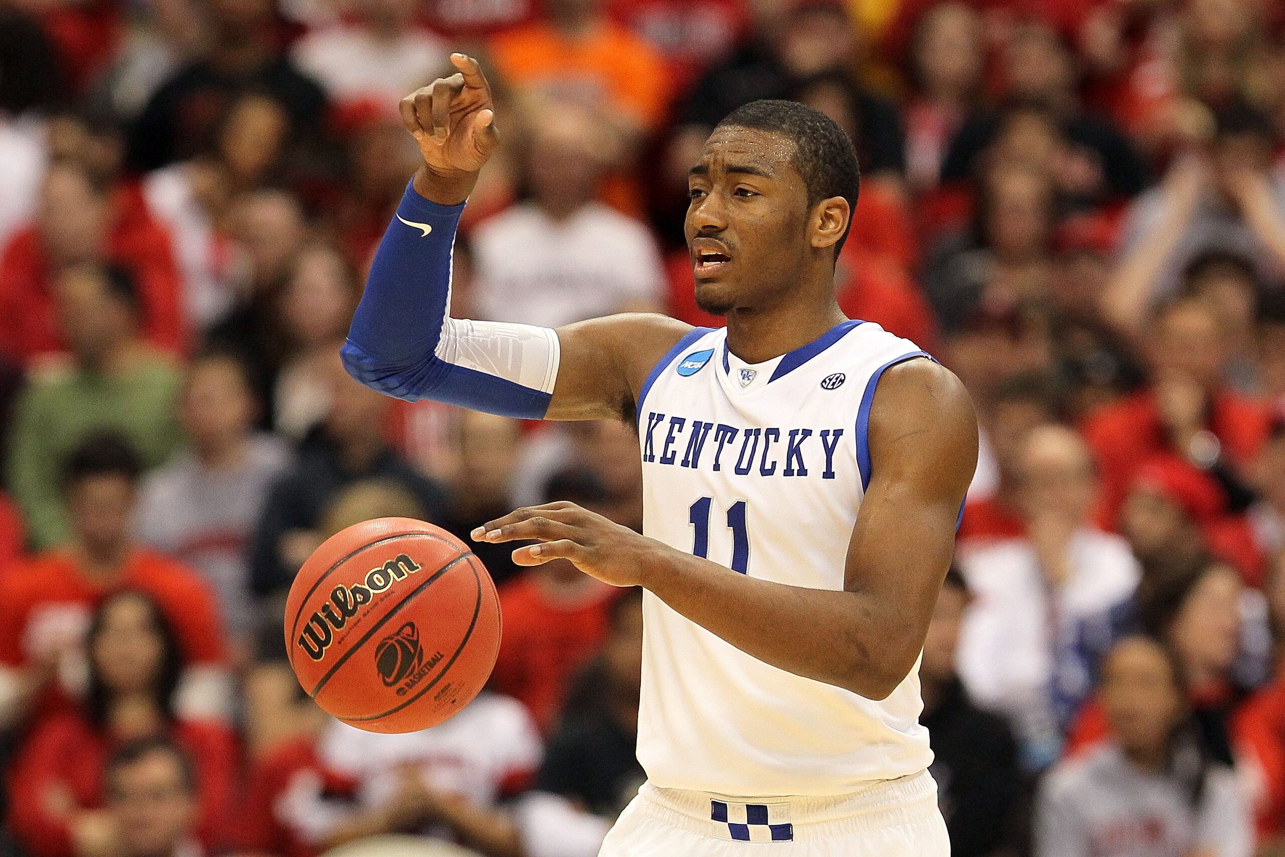 SYRACUSE, NY - MARCH 25: John Wall #11 of the Kentucky Wildcats gestures as he brings the ball up court against the Cornell Big Red during the east regional semifinal of the 2010 NCAA men's basketball tournament at the Carrier Dome on March 25, 2010 in S SYRACUSE, NY - MARCH 25: John Wall #11 of the Kentucky Wildcats gestures as he brings the ball up court against the Cornell Big Red during the east regional semifinal of the 2010 NCAA men's basketball tournament at the Carrier Dome on March 25, 2010 in S