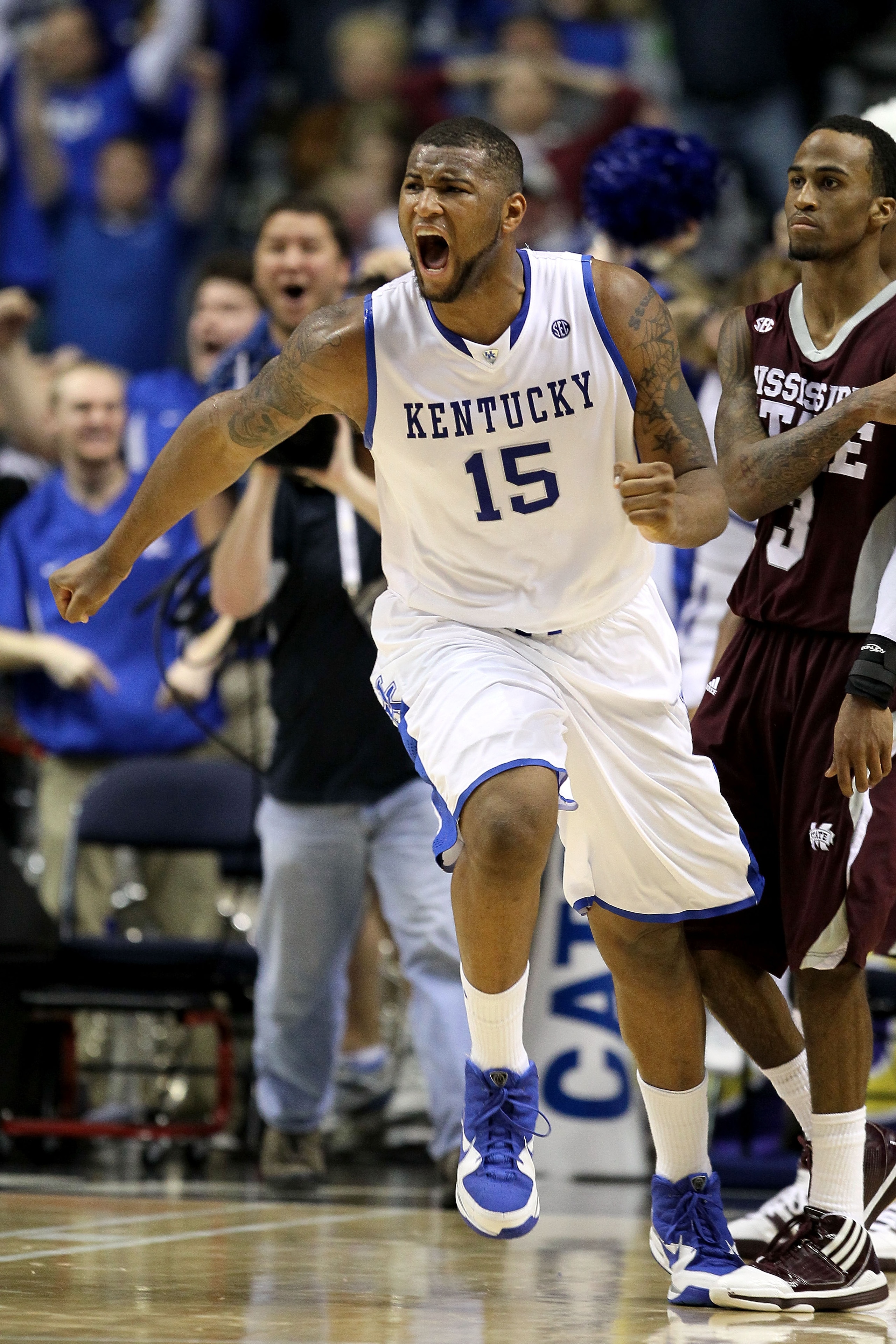 NASHVILLE, TN - MARCH 14: DeMarcus Cousins #15 of the Kentucky Wildcats celebrates after he made a 2-point basket at the end of regulation to tie the game and send it to overtime against the Mississippi State Bulldogs during the final of the SEC Men's Ba NASHVILLE, TN - MARCH 14: DeMarcus Cousins #15 of the Kentucky Wildcats celebrates after he made a 2-point basket at the end of regulation to tie the game and send it to overtime against the Mississippi State Bulldogs during the final of the SEC Men's Ba