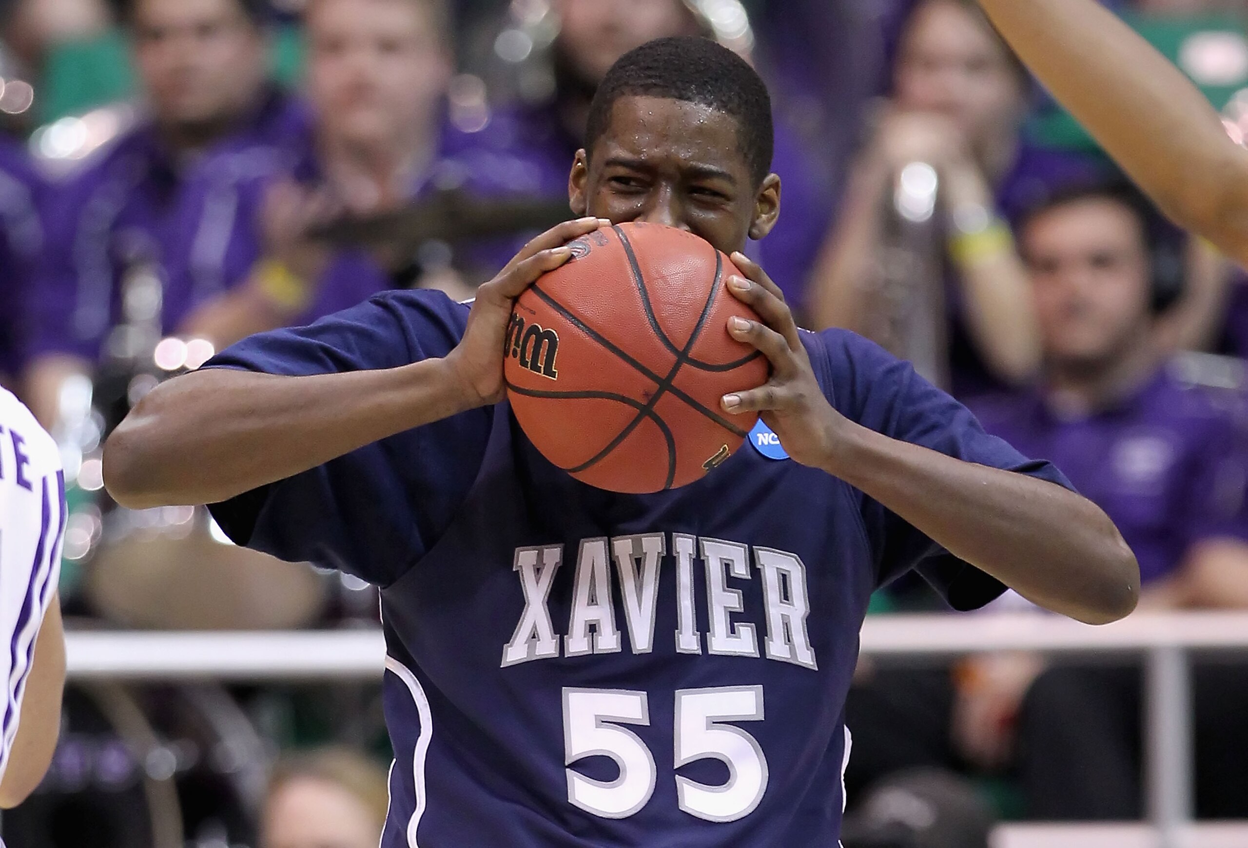 SALT LAKE CITY - MARCH 25: Jordan Crawford #55 of the Xavier Musketeers reacts after being called for a penalty against the Kansas State Wildcats during the west regional semifinal of the 2010 NCAA men's basketball tournament at the Energy Solutions Aren SALT LAKE CITY - MARCH 25: Jordan Crawford #55 of the Xavier Musketeers reacts after being called for a penalty against the Kansas State Wildcats during the west regional semifinal of the 2010 NCAA men's basketball tournament at the Energy Solutions Aren