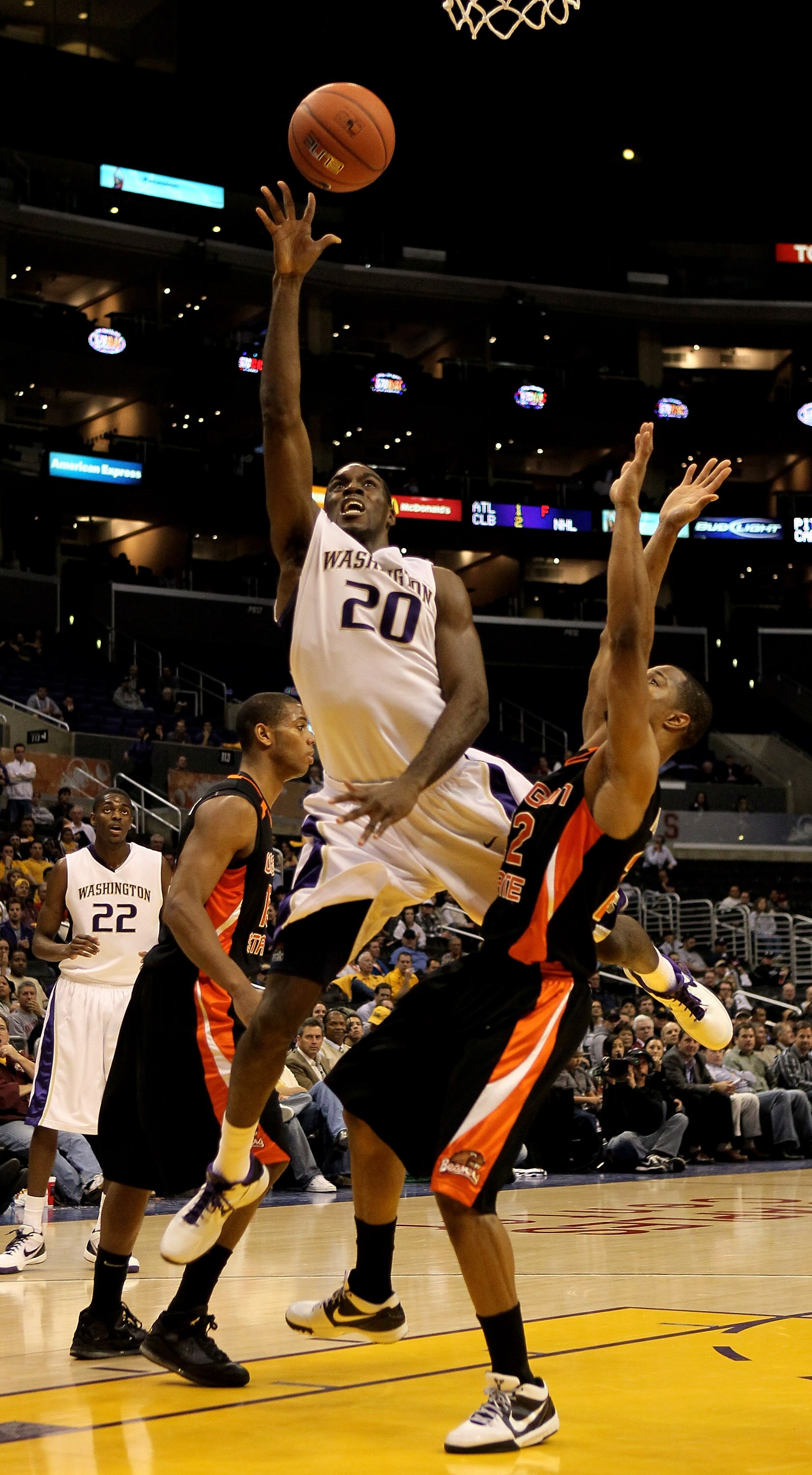 LOS ANGELES - MARCH 11: Quincy Pondexter #20 of the Washington Huskies shoots over Calvin Haynes #22 of the Oregon State Beavers during the quarterfinals of the Pac-10 Basketball Tournament at Staples Center on March 11, 2010 in Los Angeles, California.