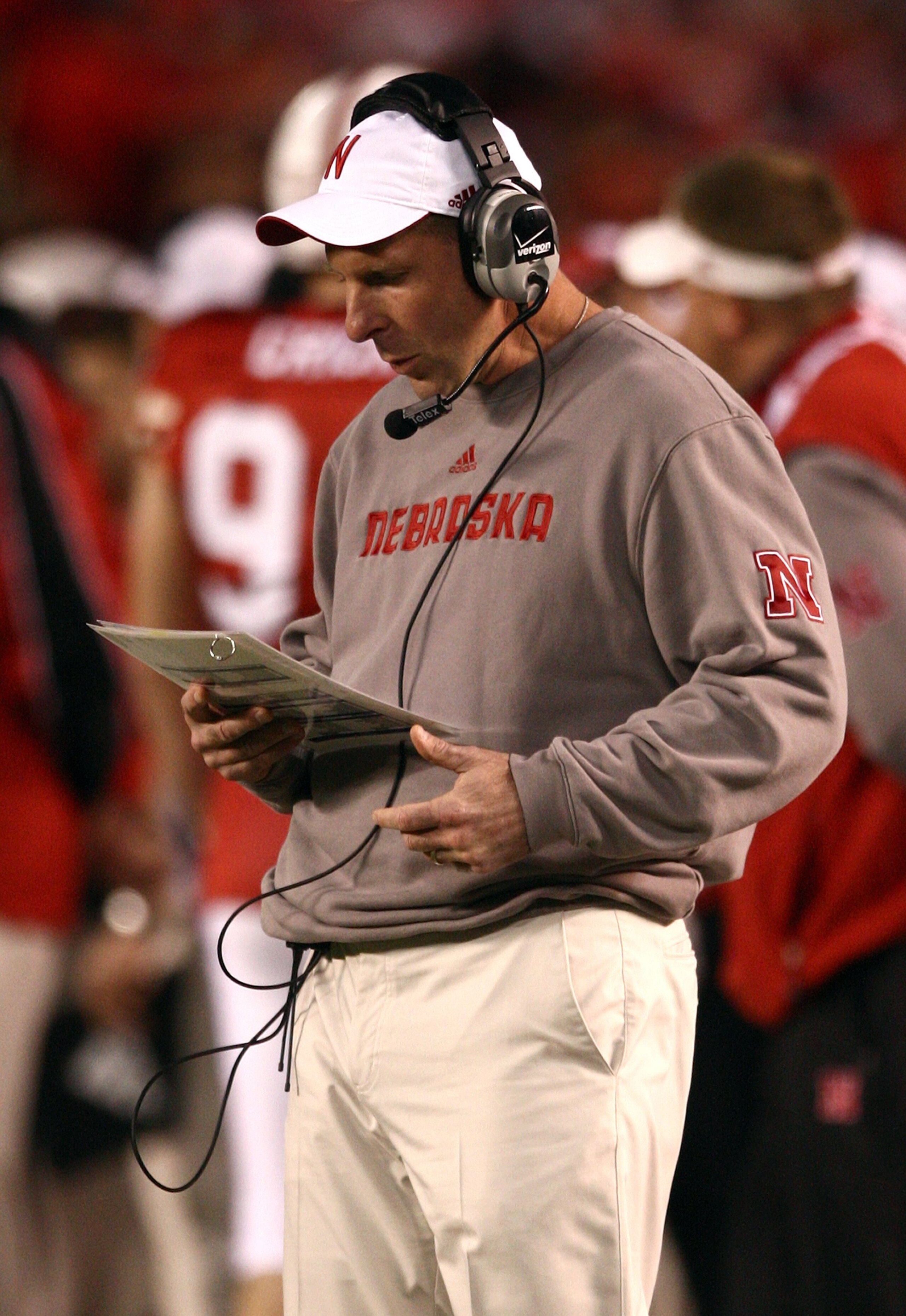 SAN DIEGO - DECEMBER 30:  Head Coach Bo Pelini of the University of Nebraska looks at his play list during the Pacific Life Holiday Bowl against University of Arizona Wildcats on December 30, 2009 at Qualcomm Stadium in San Diego, California. The Cornhusk