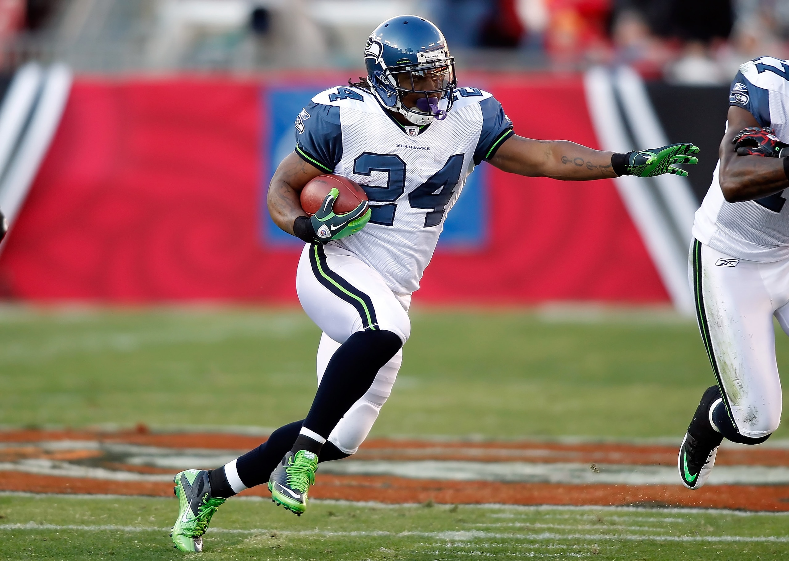 TAMPA, FL - DECEMBER 26: Running back Marshawn Lynch #24 of the Seattle Seahawks runs the ball against the Tampa Bay Buccaneers during the game at Raymond James Stadium on December 26, 2010 in Tampa, Florida. (Photo by J. Meric/Getty Images) TAMPA, FL - DECEMBER 26: Running back Marshawn Lynch #24 of the Seattle Seahawks runs the ball against the Tampa Bay Buccaneers during the game at Raymond James Stadium on December 26, 2010 in Tampa, Florida. (Photo by J. Meric/Getty Images)