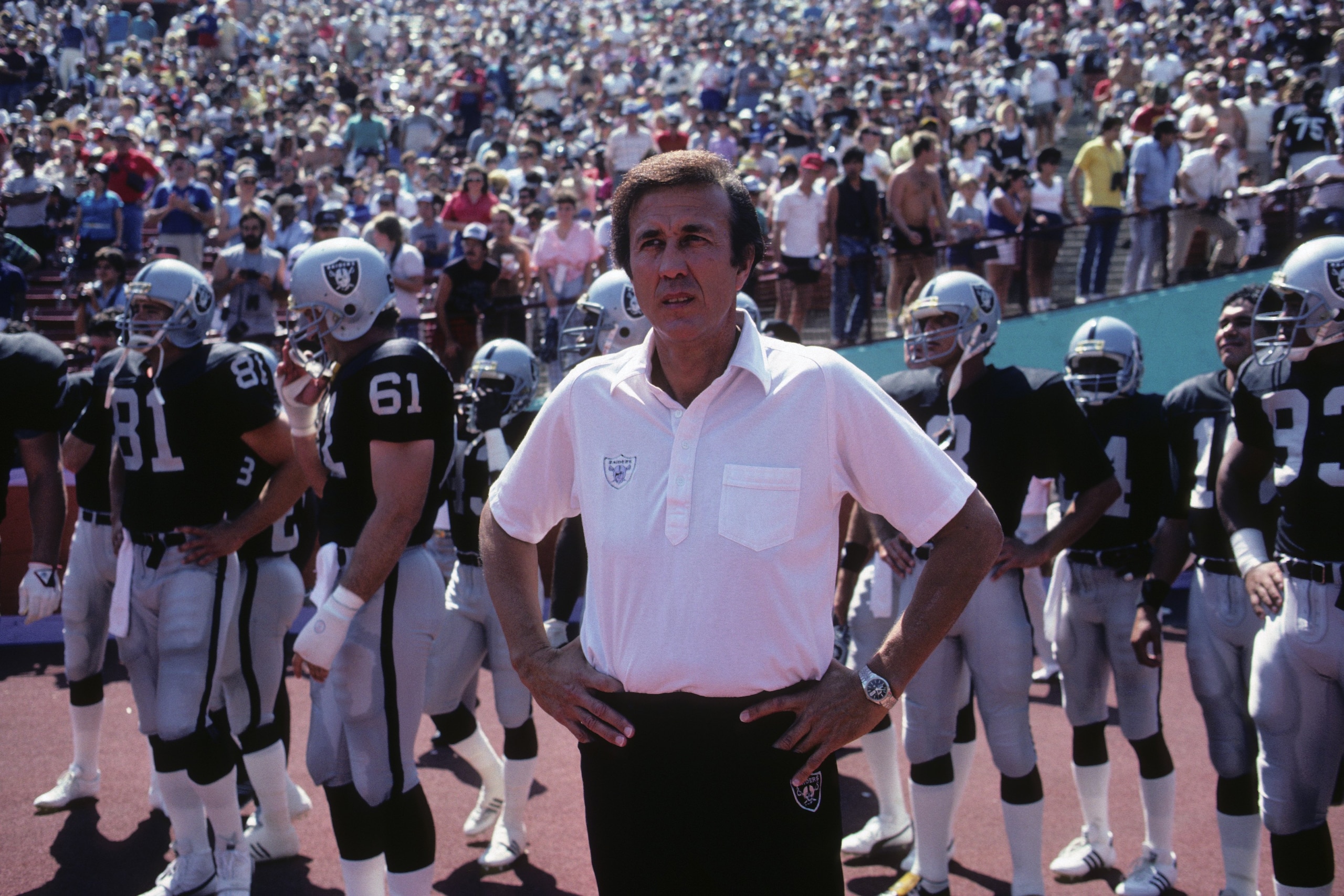 LOS ANGELES - SEPTEMBER 22:  Head coach Tom Flores of the Los Angeles Raiders and his crew stand on the side lines during the game against the San Francisco 49ers at the Los Angeles Memorial Coliseum on September 22, 1985 in Los Angeles, California.  The