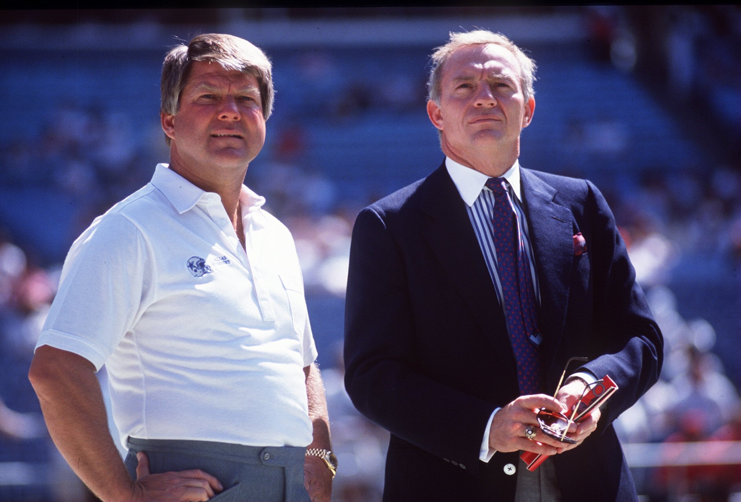 1990:  Head coach Jimmy Johnson (left) and owner Jerry Jones of the Dallas Cowboys stand together prior to the start of a Cowboys game at Texas Stadium in Irving, Texas.  Mandatory Credit: Allen Dean Steele/Allsport
