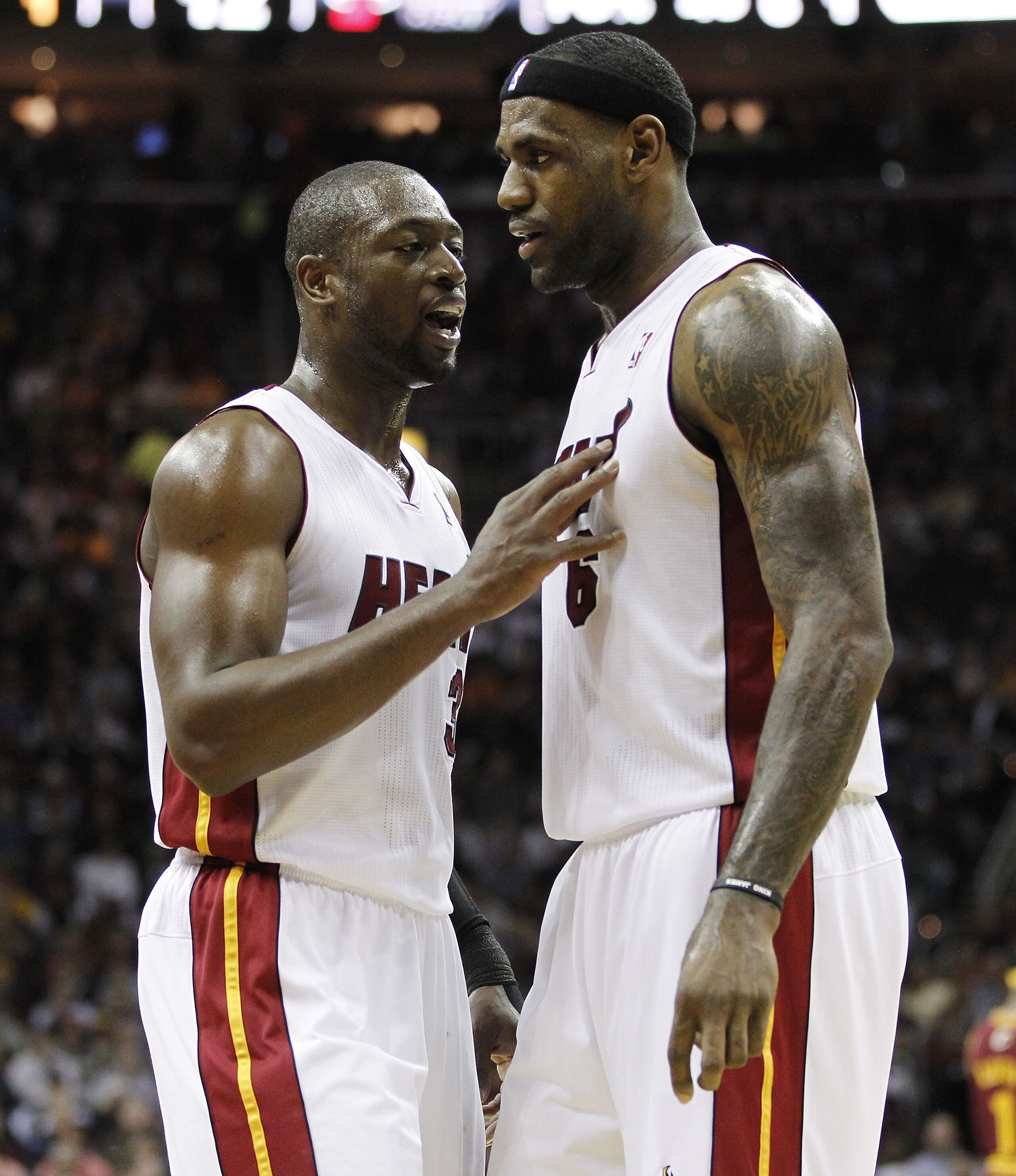 CLEVELAND, OH - DECEMBER 02: LeBron James #6 of the Miami Heat talks to Dwyane Wade #3 while playing the Cleveland Cavaliers at Quicken Loans Arena on December 2, 2010 in Cleveland, Ohio. NOTE TO USER: User expressly acknowledges and agrees that, by down CLEVELAND, OH - DECEMBER 02: LeBron James #6 of the Miami Heat talks to Dwyane Wade #3 while playing the Cleveland Cavaliers at Quicken Loans Arena on December 2, 2010 in Cleveland, Ohio. NOTE TO USER: User expressly acknowledges and agrees that, by down