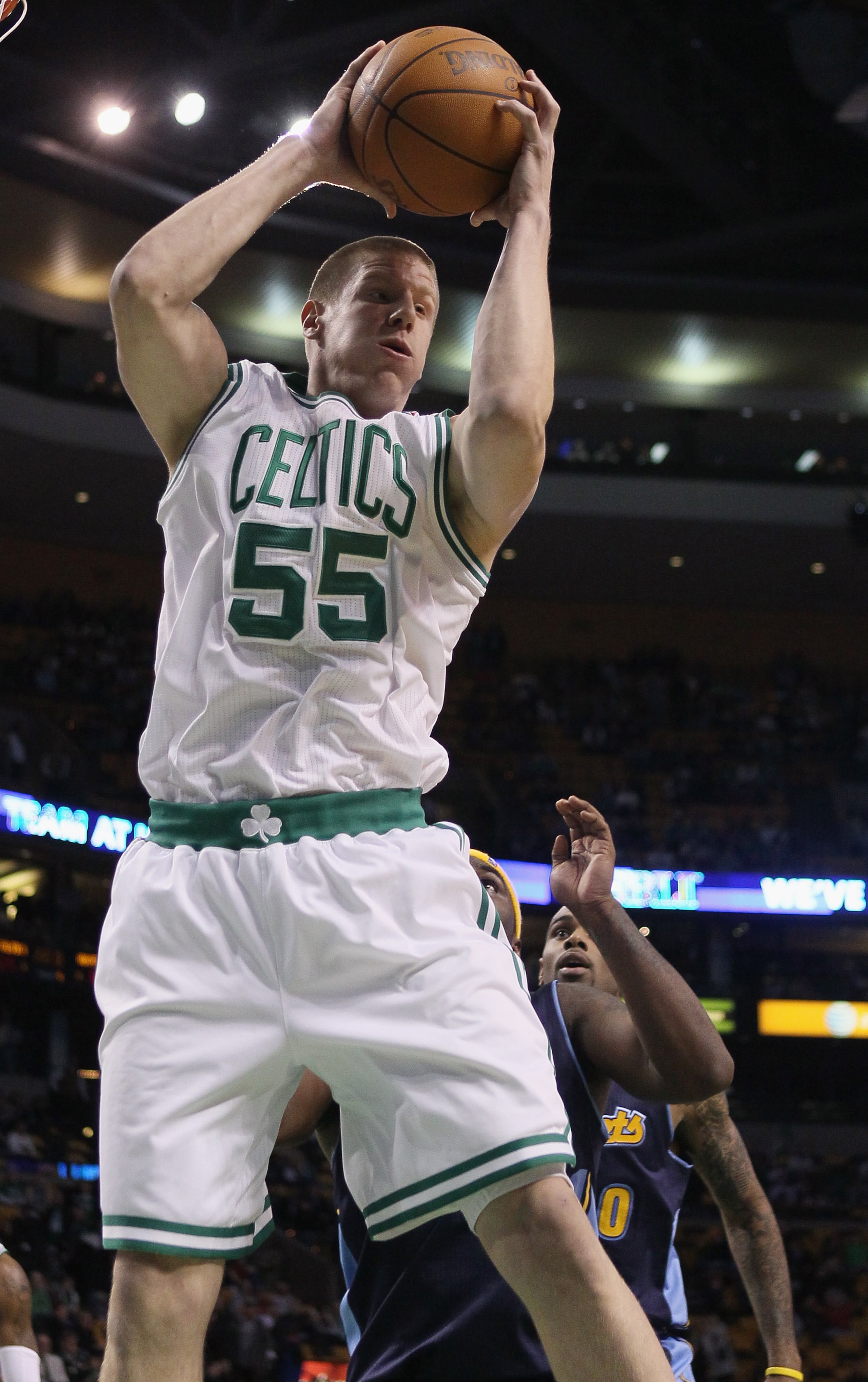 BOSTON, MA - DECEMBER 08: Luke Harangody #55 of the Boston Celtics grabs the rebound in the fourth quarter against the Denver Nuggets on December 8, 2010 at the TD Garden in Boston, Massachusetts. The Celtics defeated the Nuggets 105-89. NOTE TO USER: Us BOSTON, MA - DECEMBER 08: Luke Harangody #55 of the Boston Celtics grabs the rebound in the fourth quarter against the Denver Nuggets on December 8, 2010 at the TD Garden in Boston, Massachusetts. The Celtics defeated the Nuggets 105-89. NOTE TO USER: Us