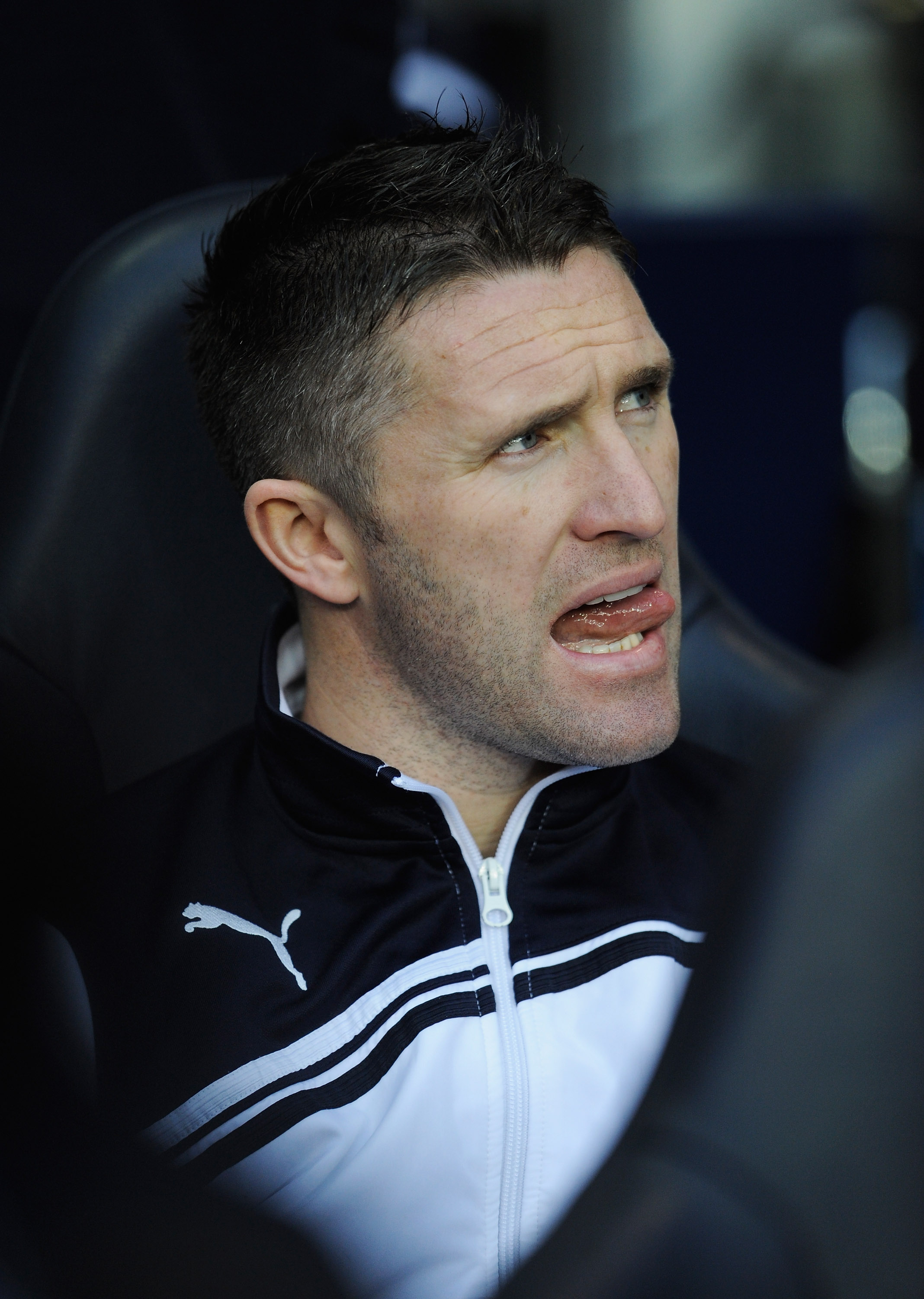 LONDON, ENGLAND - DECEMBER 28: Robbie Keane of Tottenham Hotspur looks on from the bench ahead of the Barclays Premier League match between Tottenham Hotspur and Newcastle United at White Hart Lane on December 28, 2010 in London, England.  (Photo by Micha