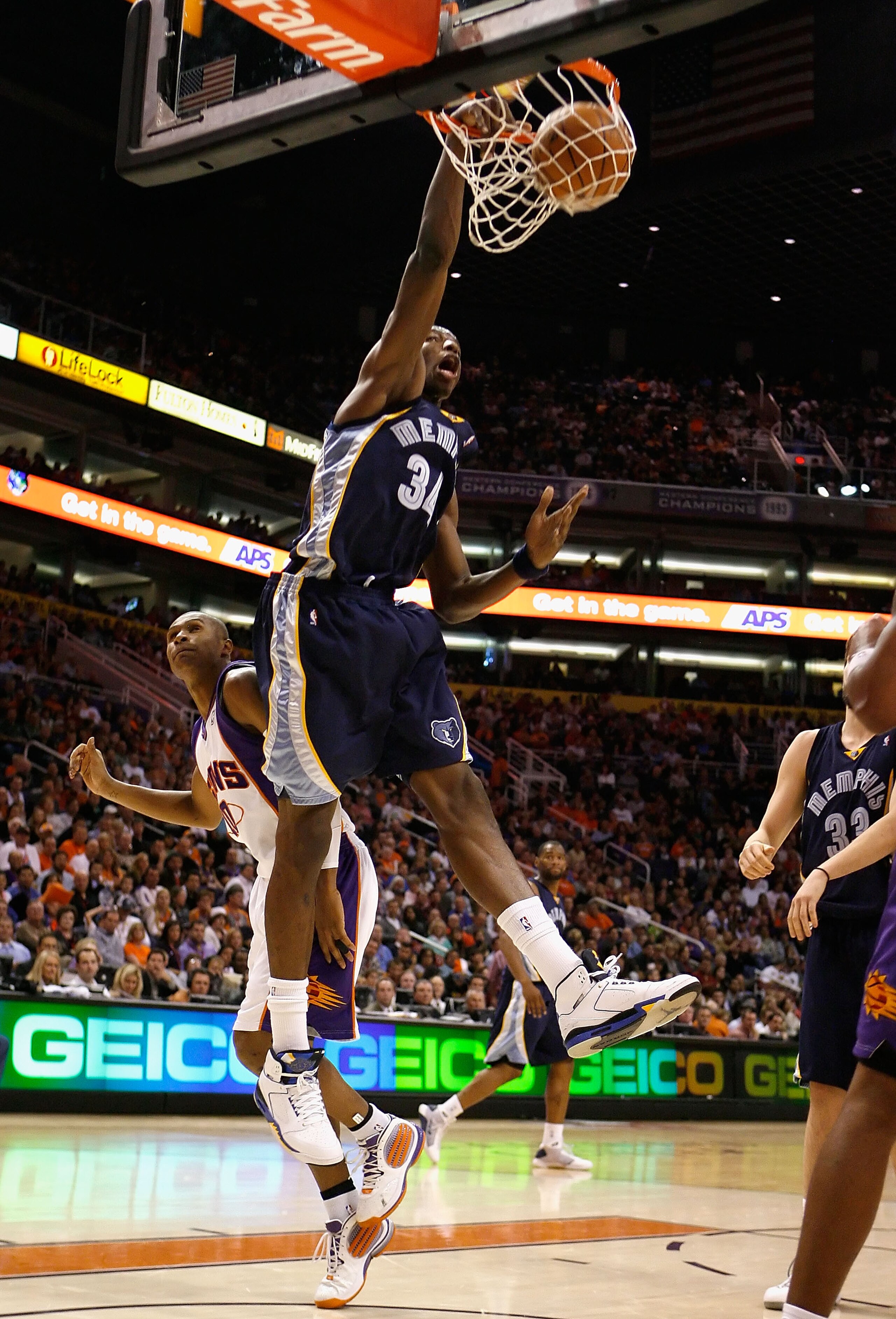 PHOENIX - NOVEMBER 25: Hasheem Thabeet #34 of the Memphis Grizzlies slam dunks the ball over Leandro Barbosa #10 of the Phoenix Suns during the NBA game at US Airways Center on November 25, 2009 in Phoenix, Arizona. NOTE TO USER: User expressly acknowled PHOENIX - NOVEMBER 25: Hasheem Thabeet #34 of the Memphis Grizzlies slam dunks the ball over Leandro Barbosa #10 of the Phoenix Suns during the NBA game at US Airways Center on November 25, 2009 in Phoenix, Arizona. NOTE TO USER: User expressly acknowled