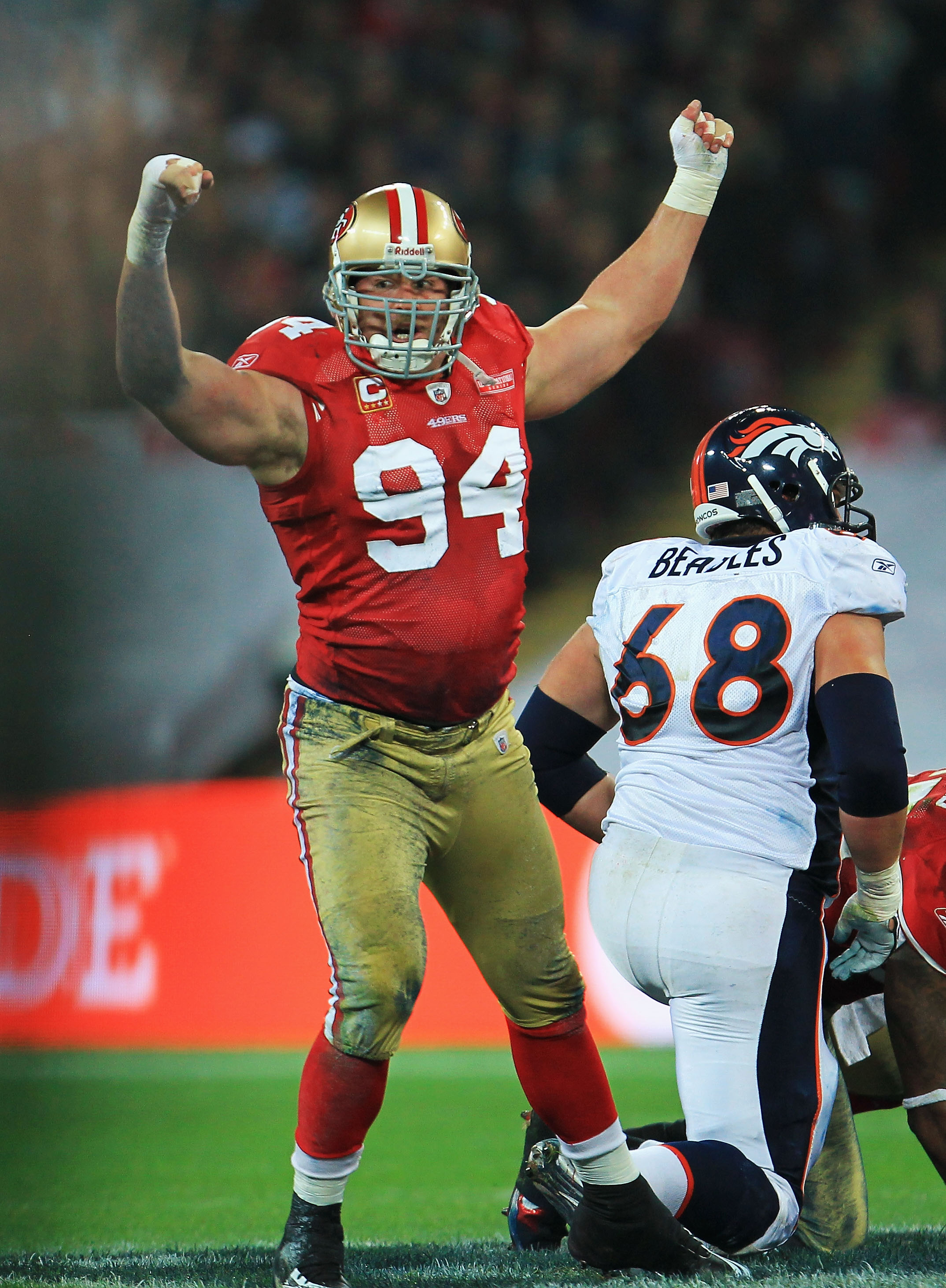 LONDON, ENGLAND - OCTOBER 31: Justin Smith #94 of San Francisco 49ers celebrates sacking Kyle Orton the Denver Broncos Quarterback during the NFL International Series match between Denver Broncos and San Francisco 49ers at Wembley Stadium on October 31,