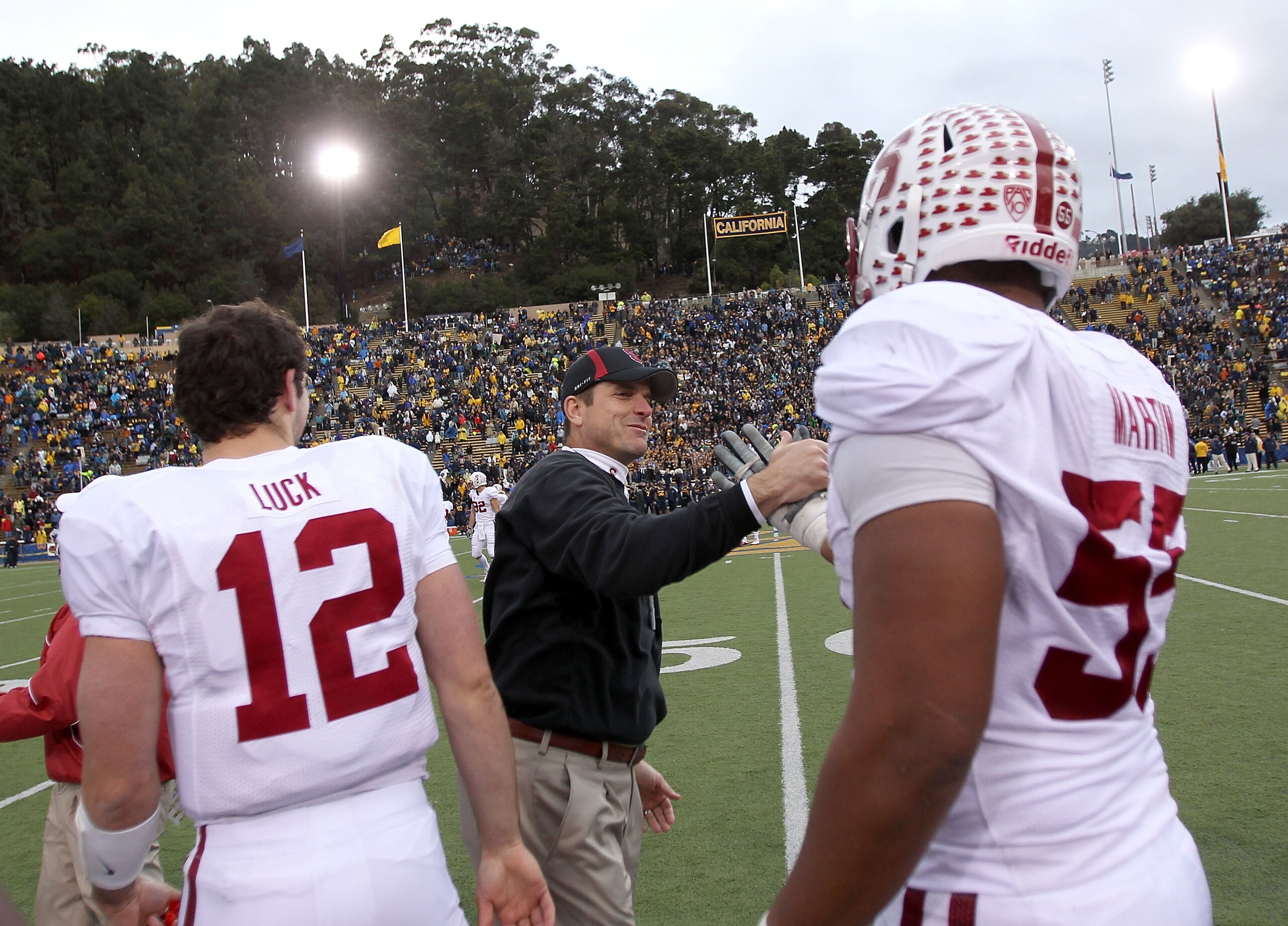 BERKELEY, CA - NOVEMBER 20:  Head coach Jim Harbaugh and Jonathan Martin #55 of the Stanford Cardinal shake hands after beating the California Golden Bears at California Memorial Stadium on November 20, 2010 in Berkeley, California.  (Photo by Ezra Shaw/G