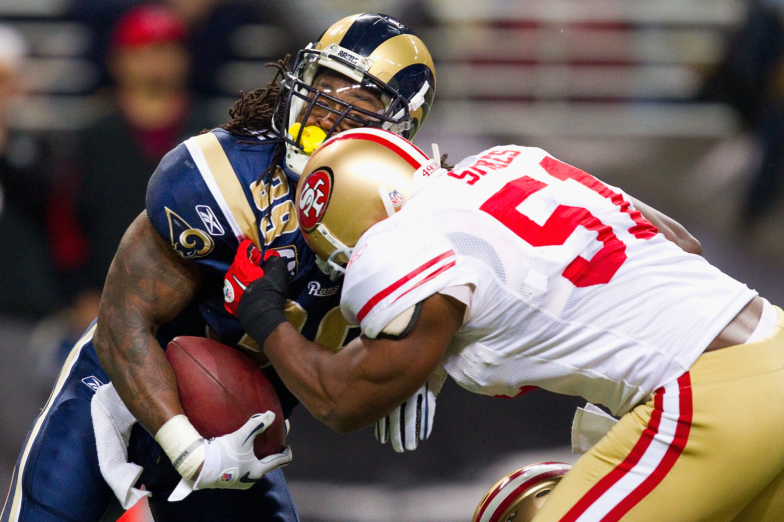 ST. LOUIS, MO - DECEMBER 26: Steven Jackson #39 of the St. Louis Rams is tackled by Takeo Spikes #51 of the San Francisco 49ers at the Edward Jones Dome on December 26, 2010 in St. Louis, Missouri. The Rams beat the 49ers 25-17. (Photo by Dilip Vishwanat/