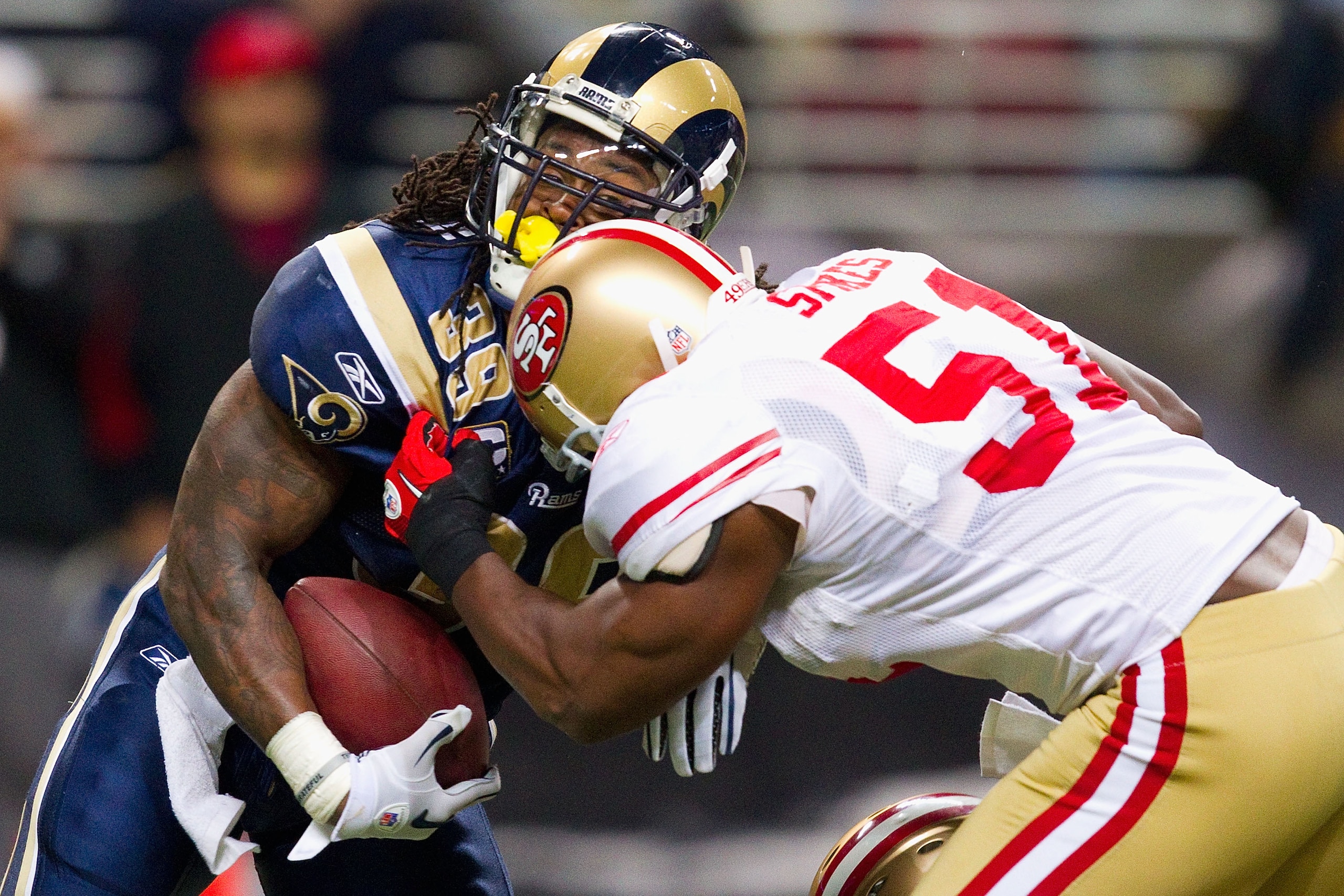 ST. LOUIS, MO - DECEMBER 26: Steven Jackson #39 of the St. Louis Rams is tackled by Takeo Spikes #51 of the San Francisco 49ers at the Edward Jones Dome on December 26, 2010 in St. Louis, Missouri. The Rams beat the 49ers 25-17. (Photo by Dilip Vishwanat/ ST. LOUIS, MO - DECEMBER 26: Steven Jackson #39 of the St. Louis Rams is tackled by Takeo Spikes #51 of the San Francisco 49ers at the Edward Jones Dome on December 26, 2010 in St. Louis, Missouri. The Rams beat the 49ers 25-17. (Photo by Dilip Vishwanat/