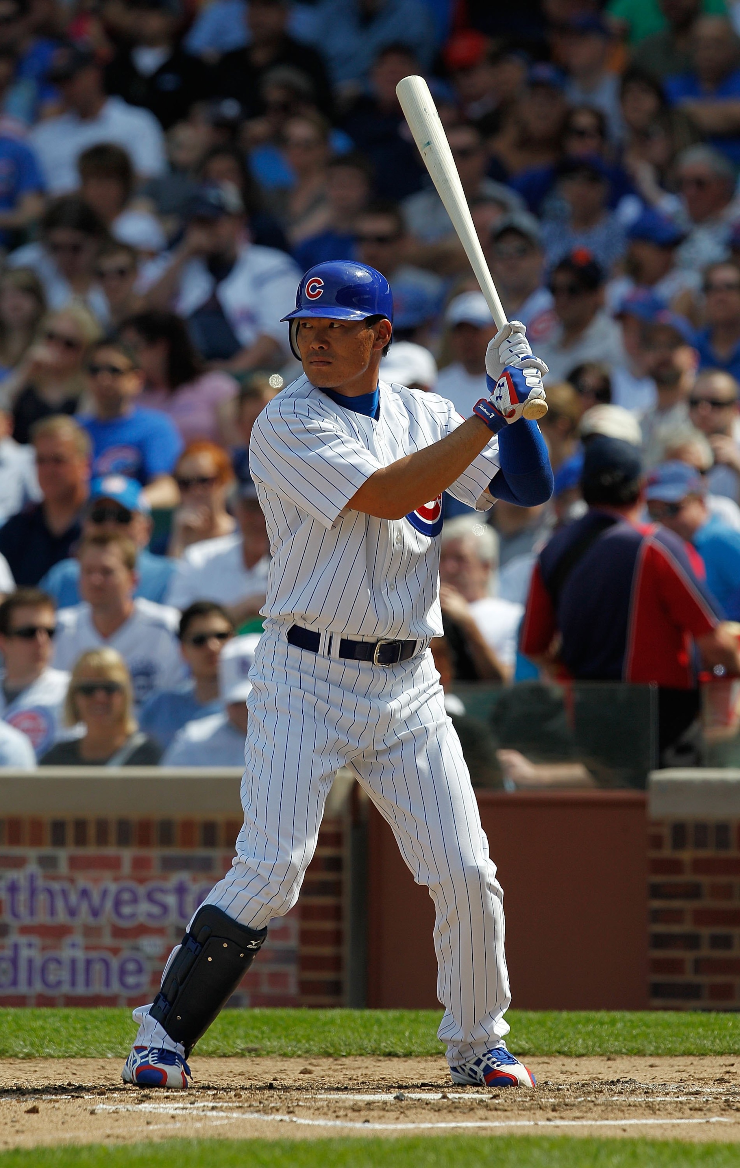 CHICAGO - APRIL 15: Kosuke Fukudome of the Chicago Cubs, wearing a number 42 jersey in honor of Jackie Robinson, prepares to bat against the Milwaukee Brewers at Wrigley Field on April 15, 2010 in Chicago, Illinois. The Brewers defeated the Cubs 8-6.  (Ph