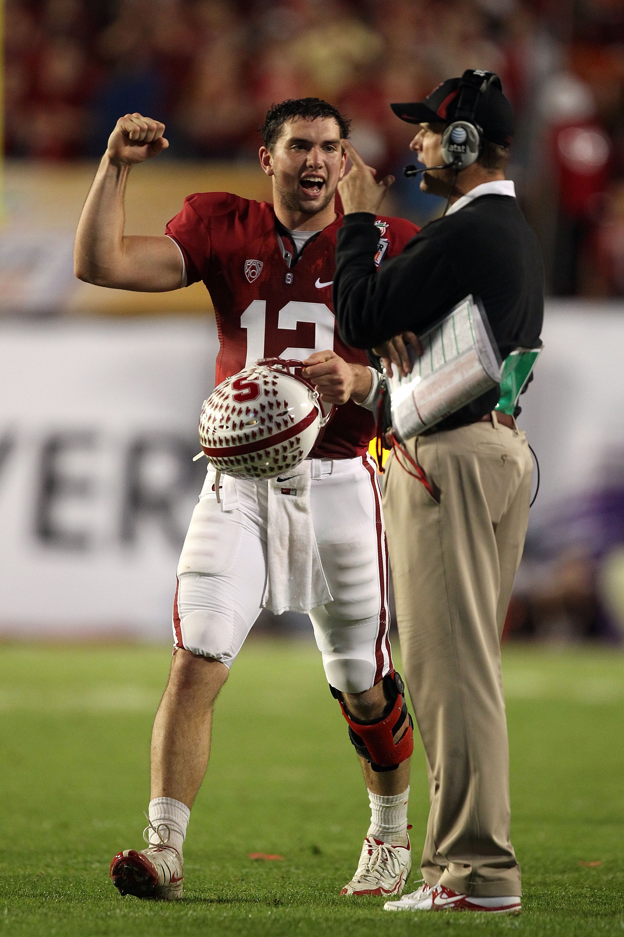 MIAMI, FL - JANUARY 03: (L-R) Andrew Luck #12 and head coach Jim Harbaugh of the Stanford Cardinal celebrate a play in the second quarter against the Virginia Tech Hokies during the 2011 Discover Orange Bowl at Sun Life Stadium on January 3, 2011 in Miami