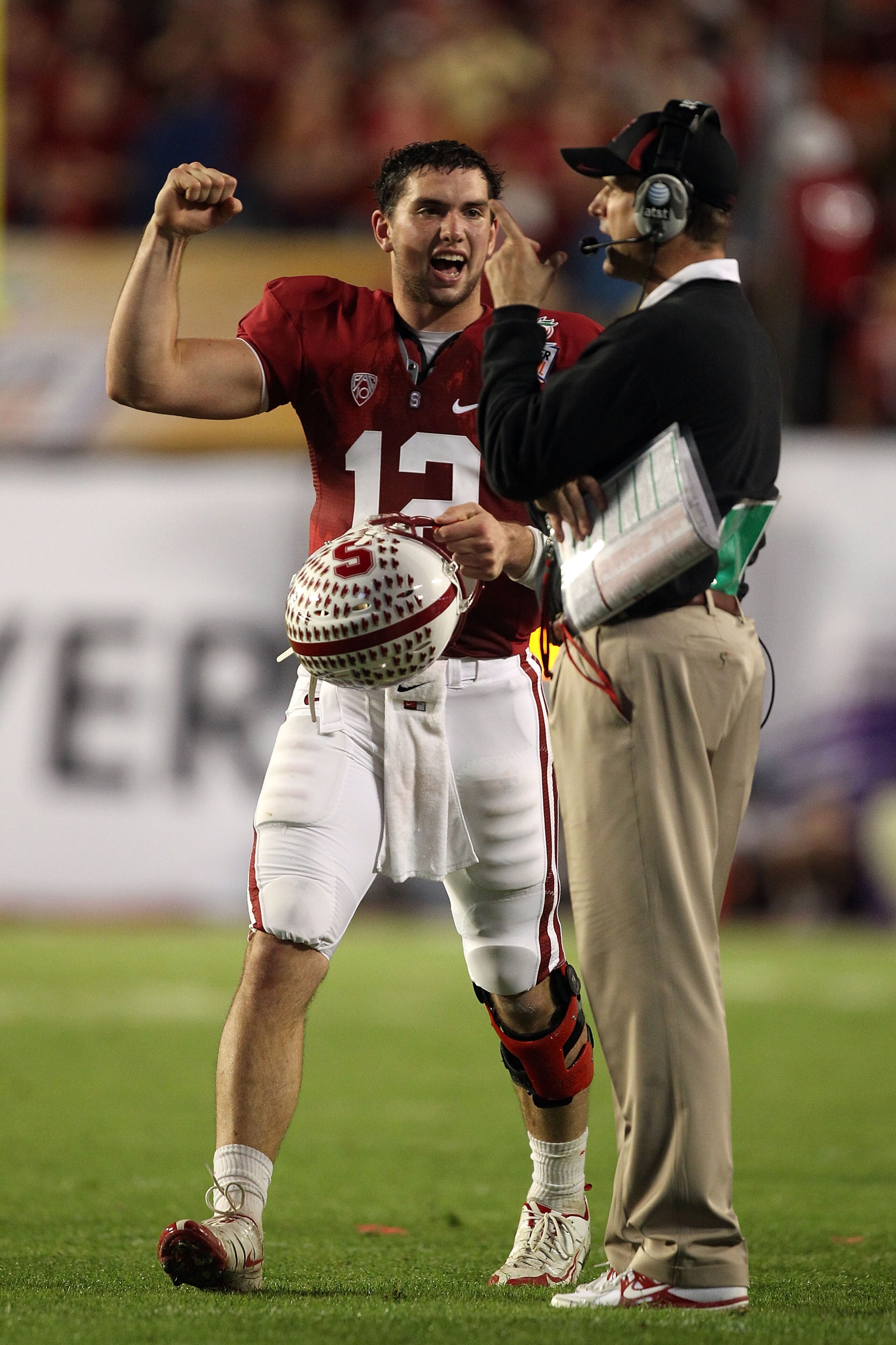 MIAMI, FL - JANUARY 03: (L-R) Andrew Luck #12 and head coach Jim Harbaugh of the Stanford Cardinal celebrate a play in the second quarter against the Virginia Tech Hokies during the 2011 Discover Orange Bowl at Sun Life Stadium on January 3, 2011 in Miami