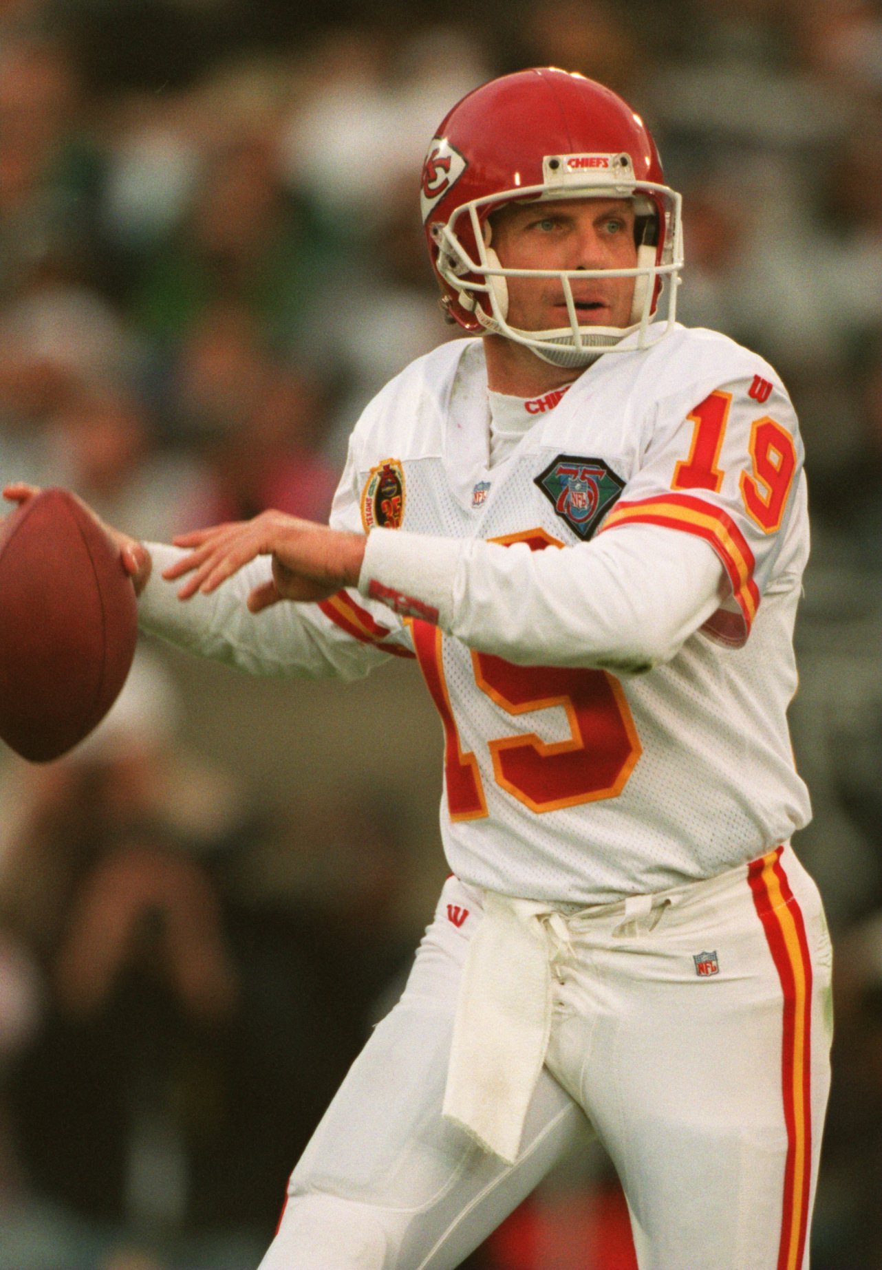 Warren Moon of the Kansas City Chiefs gets ready to pass off the