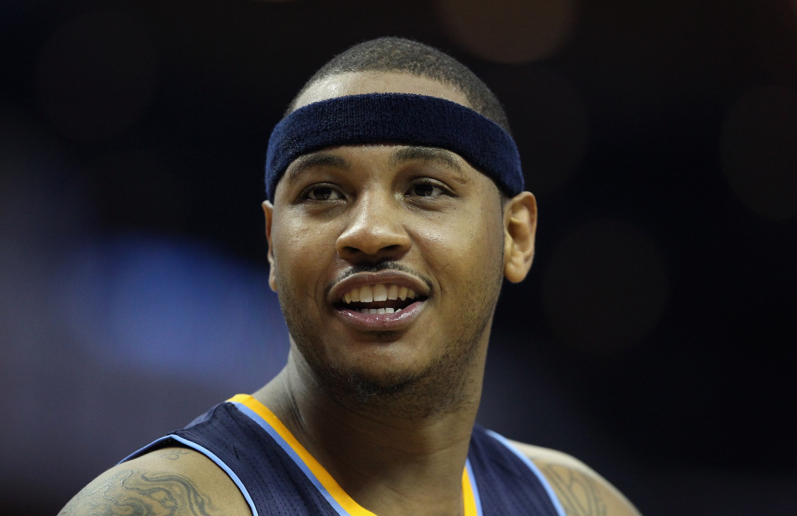 CHARLOTTE, NC - DECEMBER 07: Carmelo Anthony #15 of the Denver Nuggets watches on against the Charlotte Bobcats during their game at Time Warner Cable Arena on December 7, 2010 in Charlotte, North Carolina. NOTE TO USER: User expressly acknowledges and CHARLOTTE, NC - DECEMBER 07: Carmelo Anthony #15 of the Denver Nuggets watches on against the Charlotte Bobcats during their game at Time Warner Cable Arena on December 7, 2010 in Charlotte, North Carolina. NOTE TO USER: User expressly acknowledges and