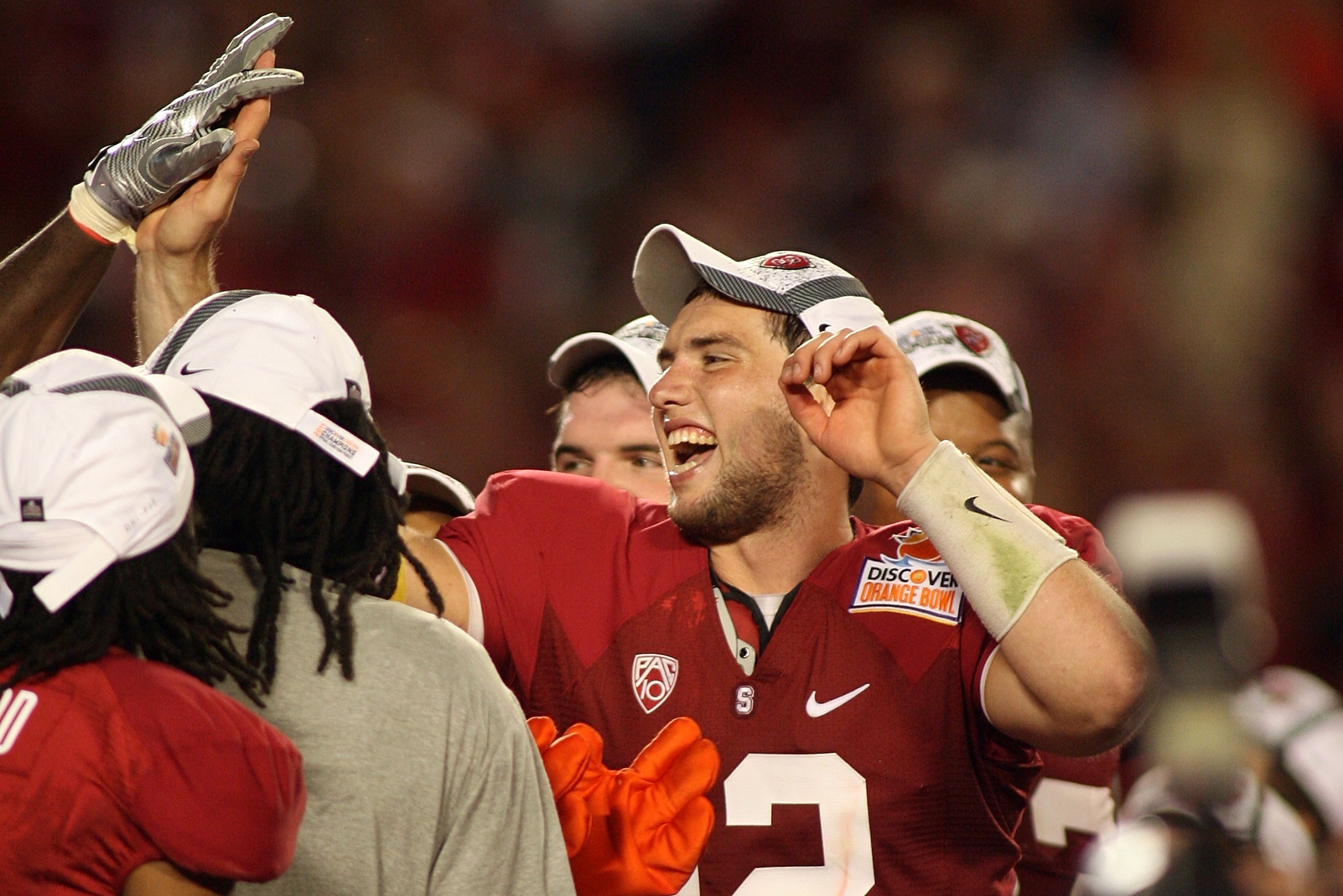 MIAMI, FL - JANUARY 03: Orange Bowl MVP Andrew Luck #12 of the Stanford Cardinal celebrates with his teammates after Stanford won 40-12 against the Virginia Tech Hokies during the 2011 Discover Orange Bowl at Sun Life Stadium on January 3, 2011 in Miami,