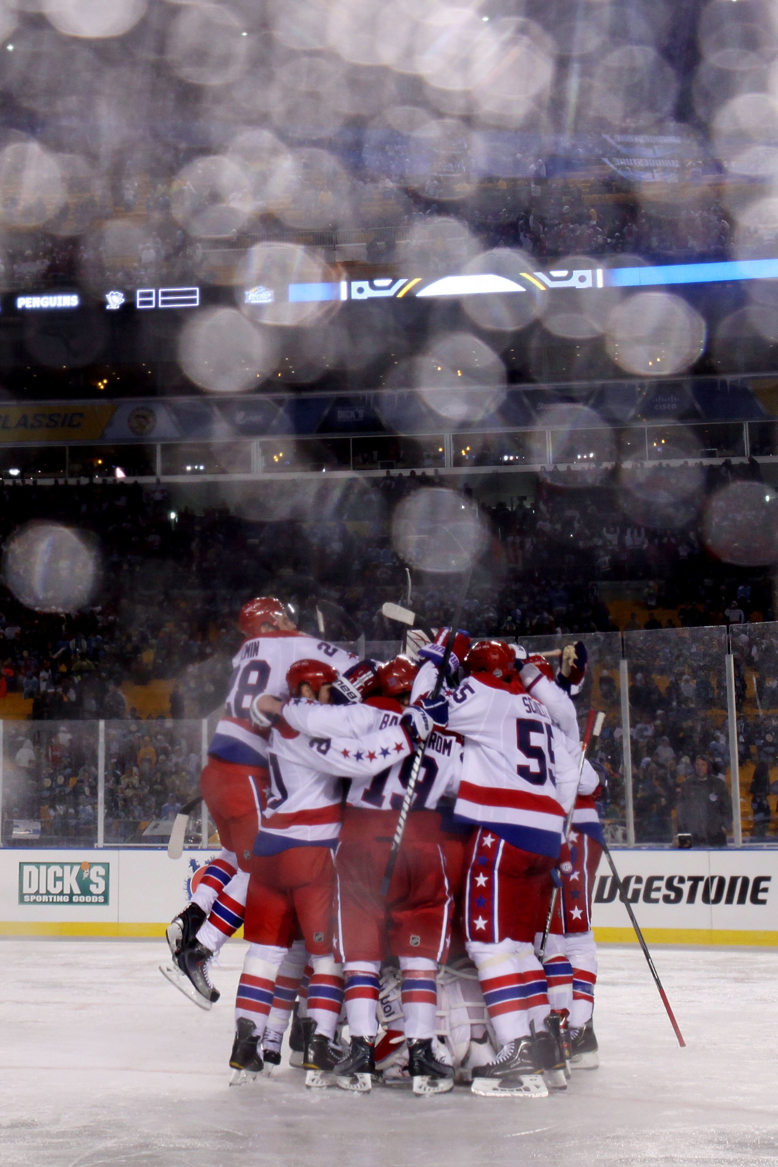 PITTSBURGH, PA - JANUARY 01:  The Washington Capitals celebrate their 3-1 victory over the Pittsburgh Penguins during the 2011 NHL Bridgestone Winter Classic at Heinz Field on January 1, 2011 in Pittsburgh, Pennsylvania.  (Photo by Jamie Squire/Getty Imag
