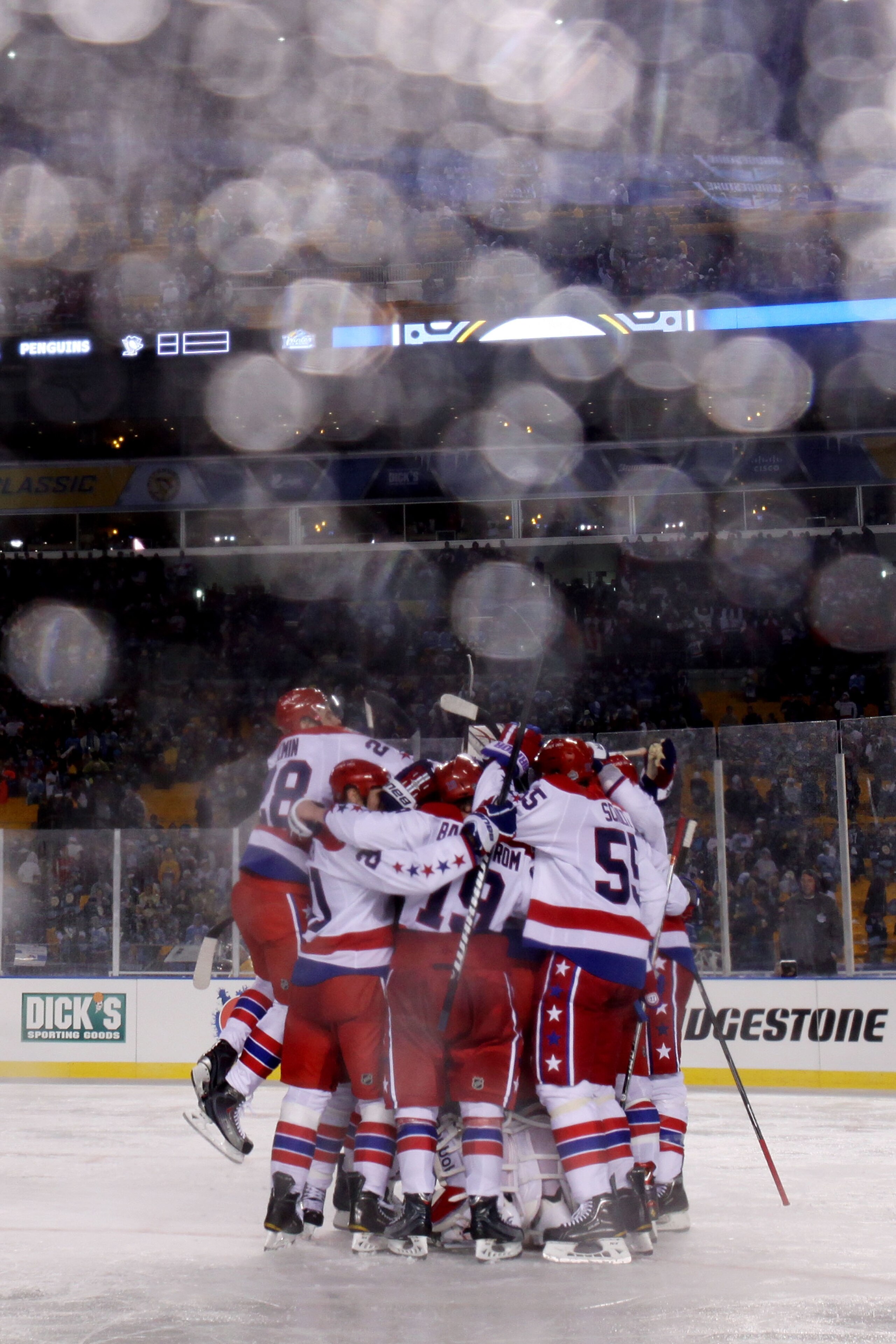 PITTSBURGH, PA - JANUARY 01:  The Washington Capitals celebrate their 3-1 victory over the Pittsburgh Penguins during the 2011 NHL Bridgestone Winter Classic at Heinz Field on January 1, 2011 in Pittsburgh, Pennsylvania.  (Photo by Jamie Squire/Getty Imag