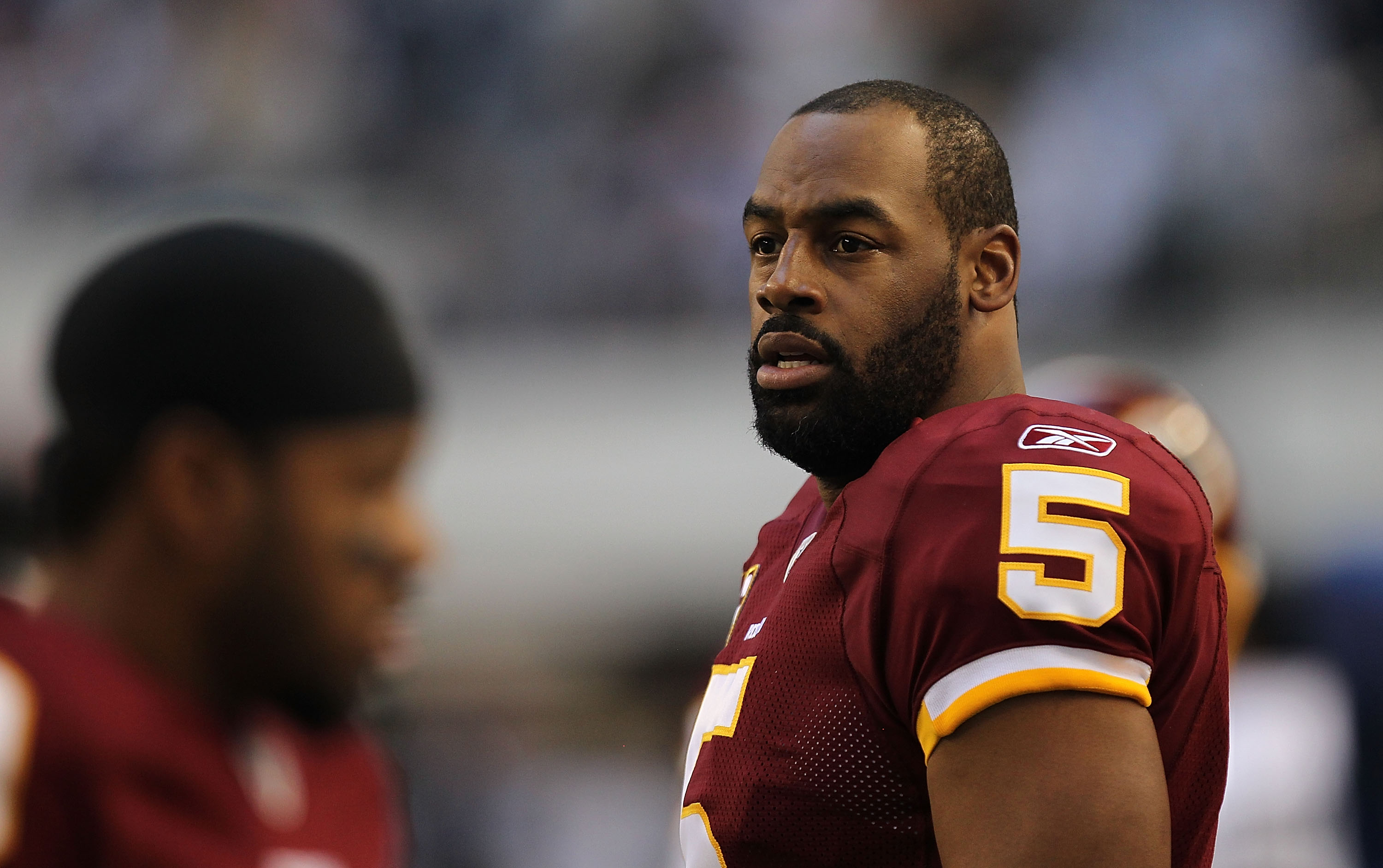 ARLINGTON, TX - DECEMBER 19:  Quarterback Donovan McNabb #5  of the Washington Redskins on the sidelines against play against the Dallas Cowboys at Cowboys Stadium on December 19, 2010 in Arlington, Texas.  (Photo by Ronald Martinez/Getty Images)