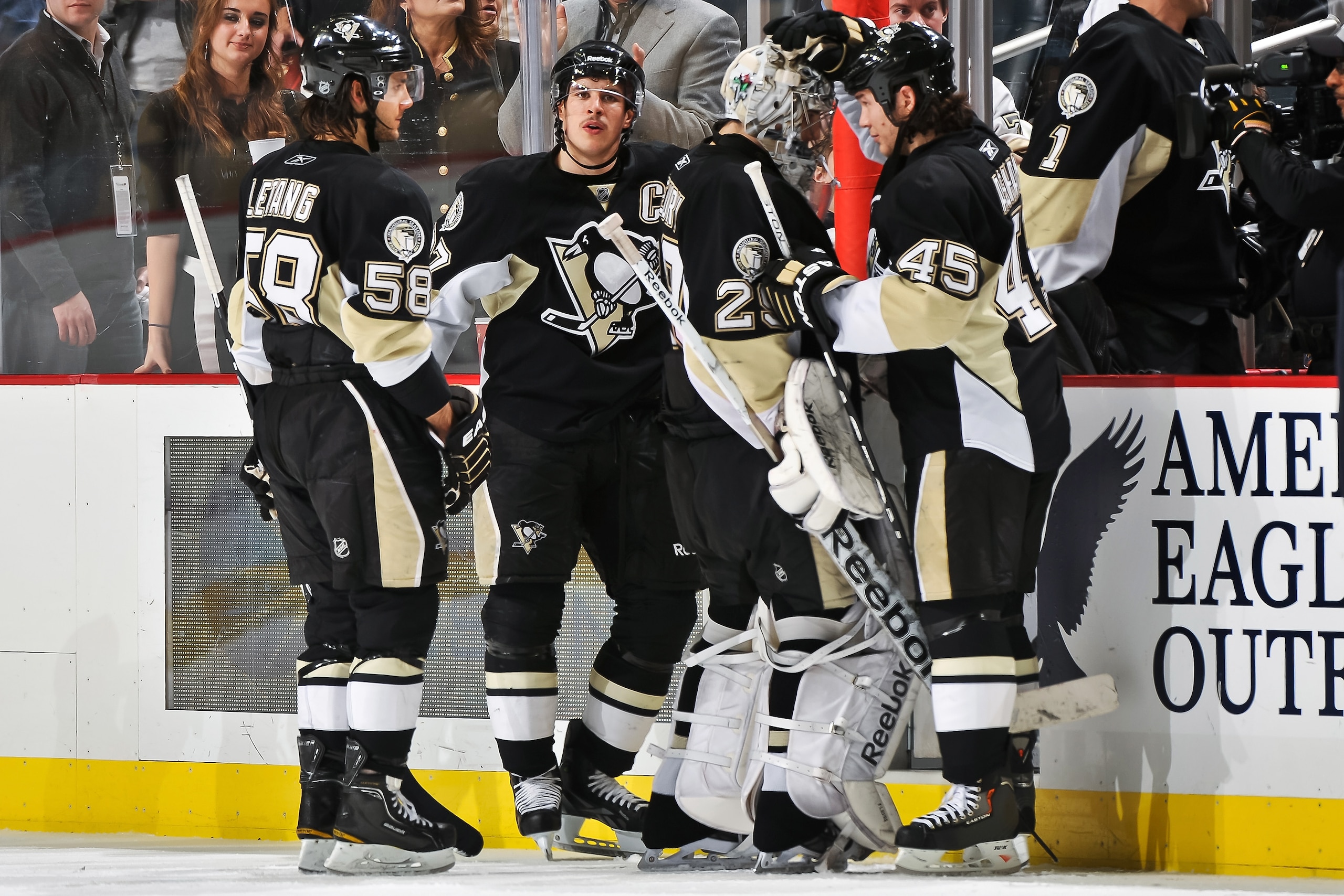 PITTSBURGH, PA - DECEMBER 20:  Arron Asham #45 of the Pittsburgh Penguins congratulates goaltender Marc-Andre Fleury #29 of the Pittsburgh Penguins after a 6-1 win over the Phoenix Coyotes as Kris Letang #58 of the Pittsburgh Penguins and Sidney Crosby #8