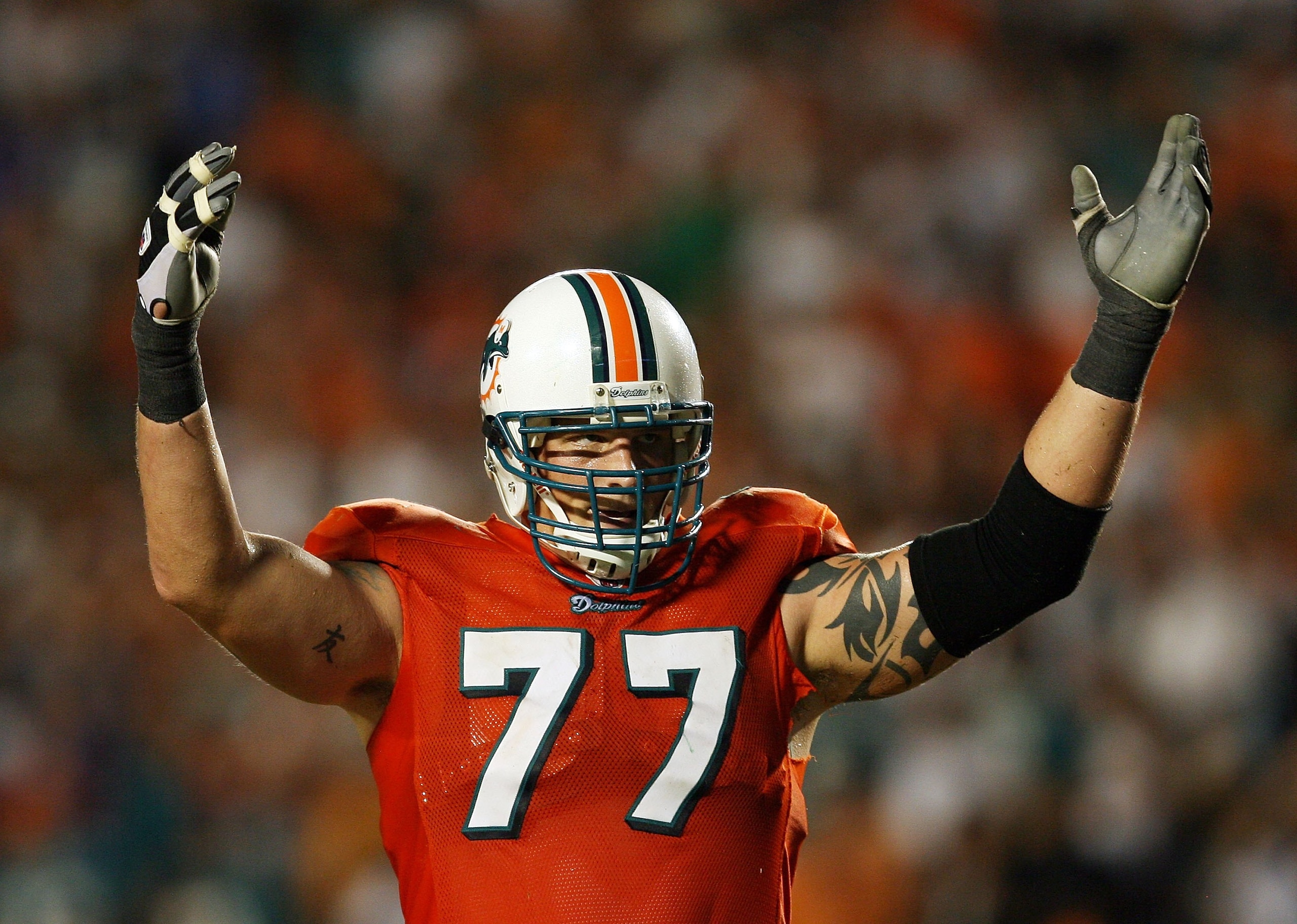 MIAMI - OCTOBER 12: Offensive lineman Jake Long #77 of the Miami Dolphins celebrates after a touchdown by Ronnie Brown #23 against the New York Jets at Land Shark Stadium on October 12, 2009 in Miami, Florida. The Dolphins defeated the Jets 31-27. (Phot MIAMI - OCTOBER 12: Offensive lineman Jake Long #77 of the Miami Dolphins celebrates after a touchdown by Ronnie Brown #23 against the New York Jets at Land Shark Stadium on October 12, 2009 in Miami, Florida. The Dolphins defeated the Jets 31-27. (Phot