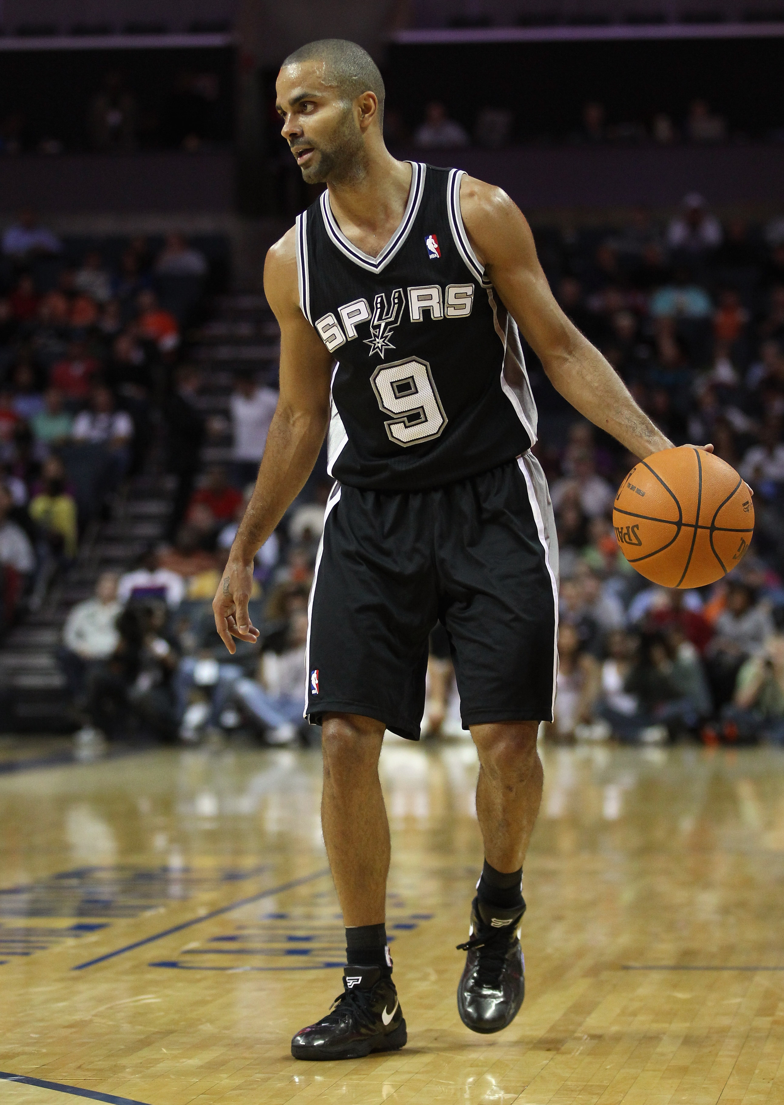 CHARLOTTE, NC - NOVEMBER 08:  Tony Parker #9 of the San Antonio Spurs against the Charlotte Bobcats during their game at Time Warner Cable Arena on November 8, 2010 in Charlotte, North Carolina.  NOTE TO USER: User expressly acknowledges and agrees that,