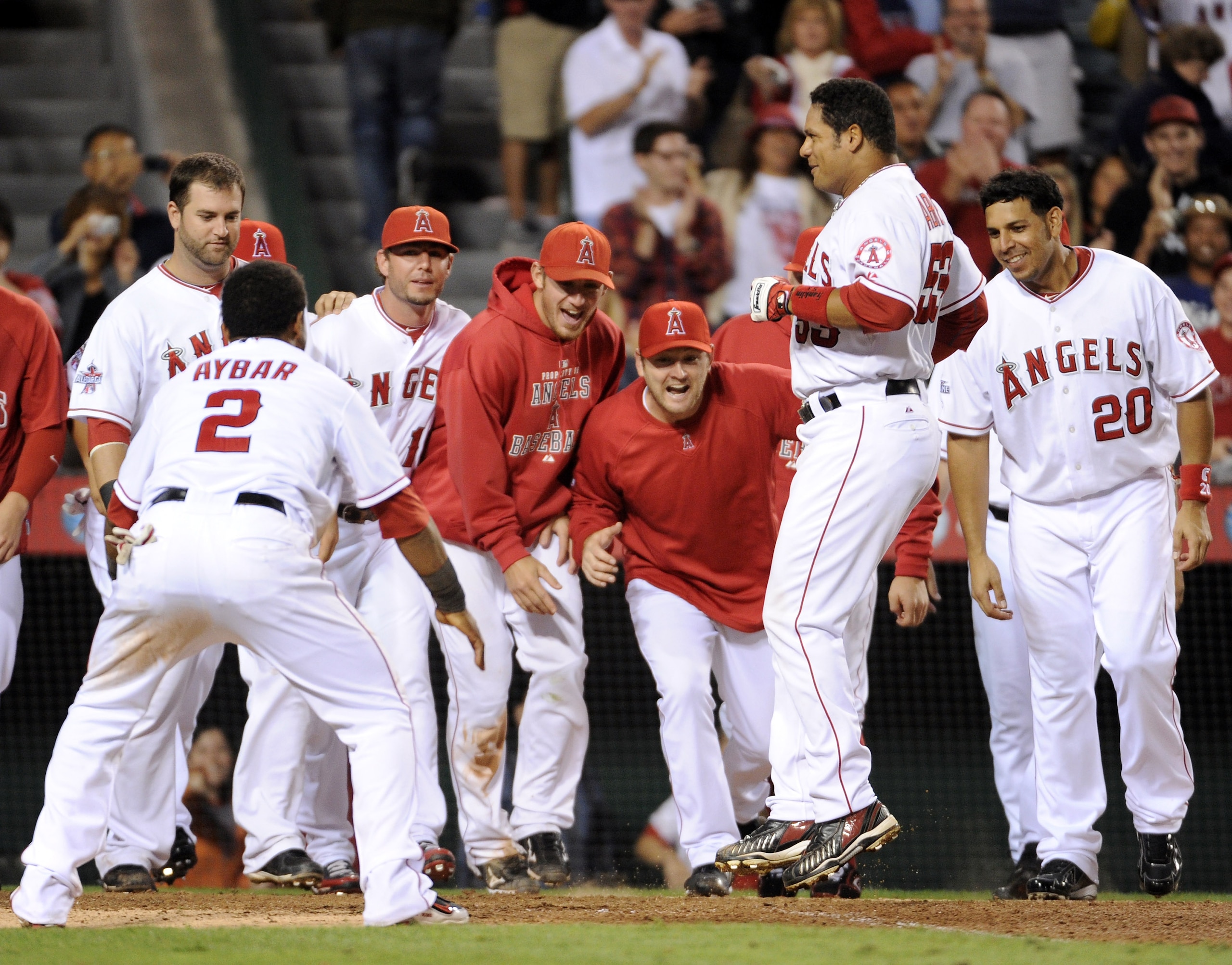 ANAHEIM, CA - SEPTEMBER 10:  Bobby Abreu #53 of the Los Angeles Angels of Anaheim celebrates his game winning homerun with his teammates for a 4-3 win over the Seattle Mariners during the 14th inning at Angel Stadium on September 10, 2010 in Anaheim, Cali