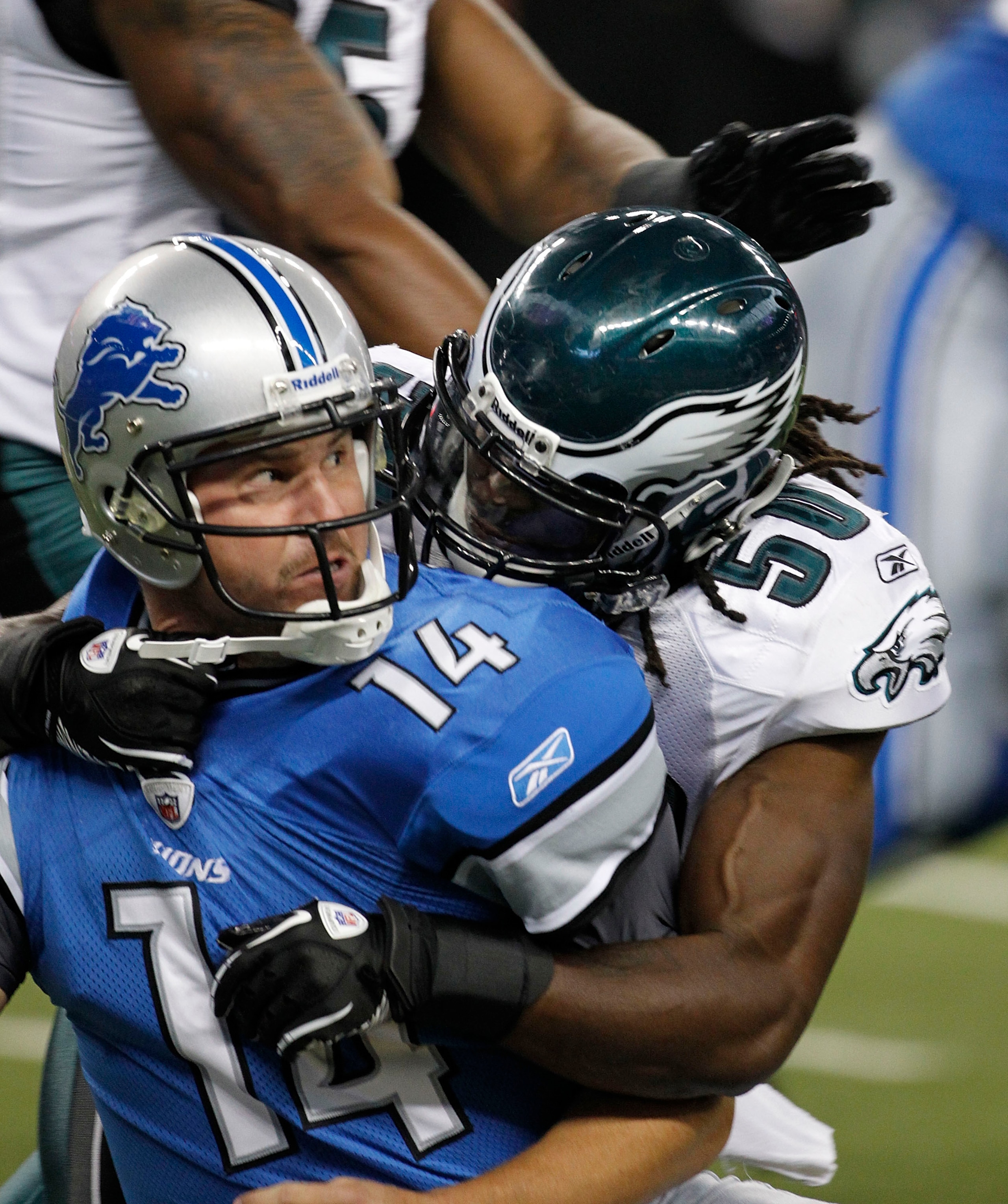 DETROIT - SEPTEMBER 19:  Shaun Hill #14 of the Detroit Lions is sacked by Ernie Sims #50 during the game against the Philadelphia Eagles at Ford Field on September 19, 2010 in Detroit, Michigan. The Eagles defeated the Lions 35-32.  (Photo by Leon Halip/G