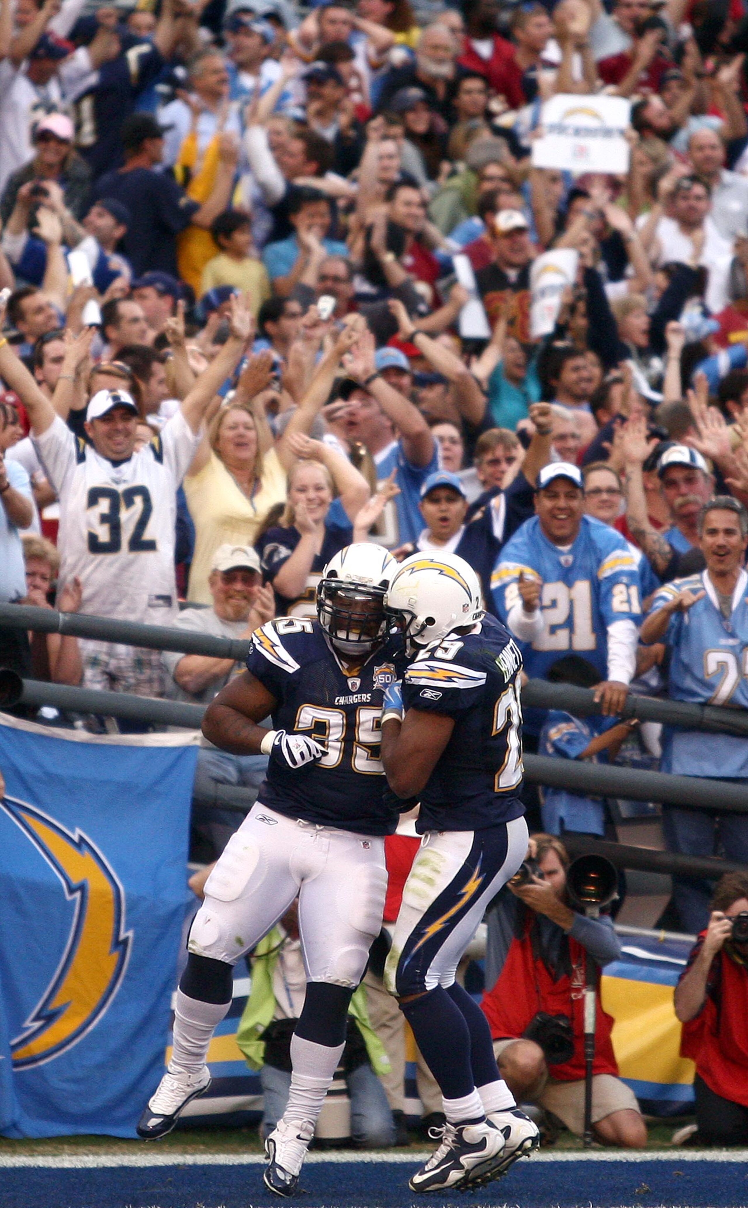 SAN DIEGO, CA - JANUARY 3:  Fullback Mike Tolbert #35 and running back Michael Bennett #29 of the San Diego Chargers celebrate Tolbert's game-winning touchdown catch for the Chargers 23-20 win over the Washington Redskins during their NFL Game on January
