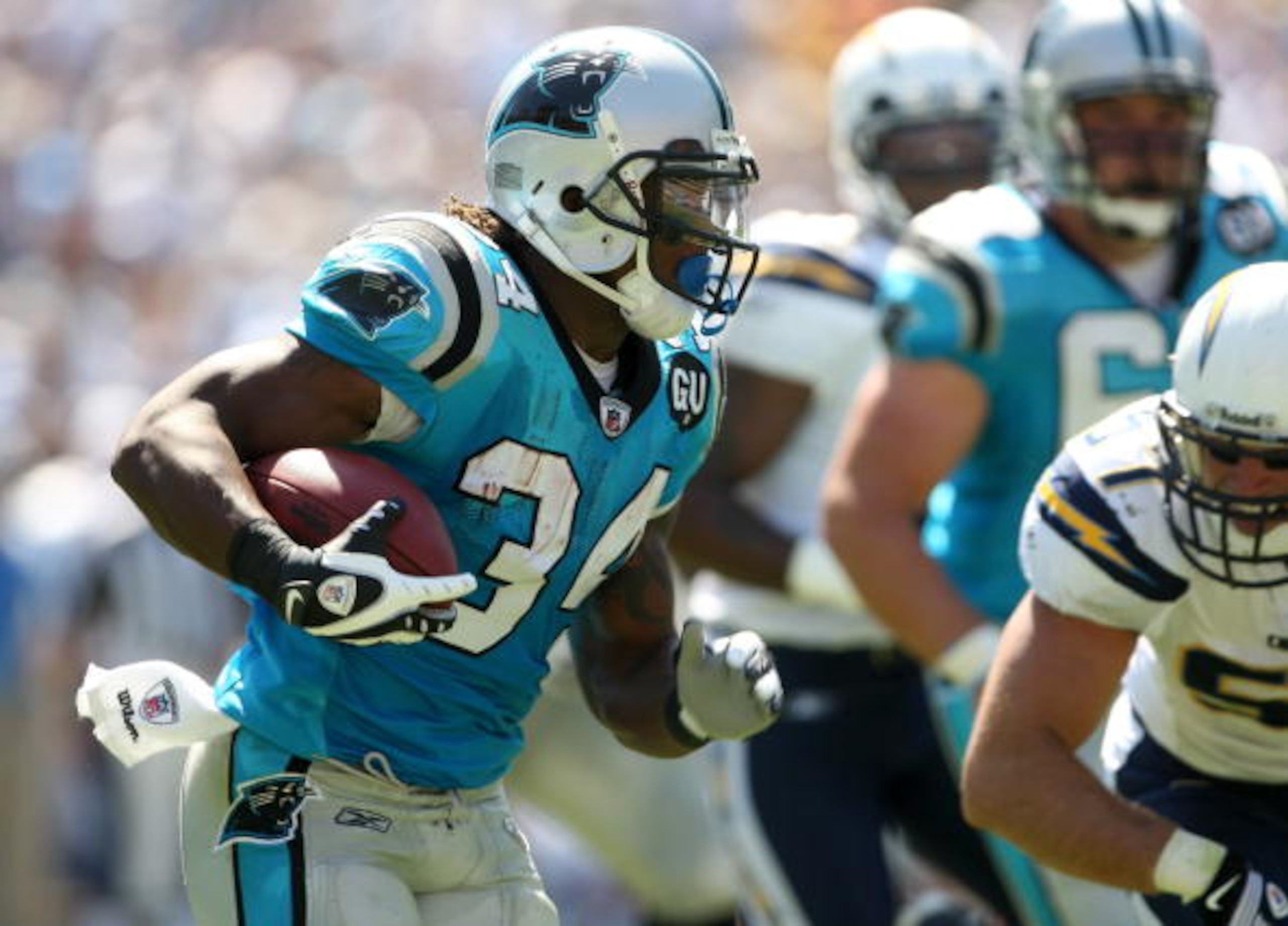 SAN DIEGO - SEPTEMBER 07: Running back DeAngelo Williams #34 of the Carolina Panthers carries the ball against the San Diego Chargers on September 7, 2008 at Qualcomm Stadium in San Diego, California. The Panthers won 26-24. (Photo by Stephen Dunn/Getty SAN DIEGO - SEPTEMBER 07: Running back DeAngelo Williams #34 of the Carolina Panthers carries the ball against the San Diego Chargers on September 7, 2008 at Qualcomm Stadium in San Diego, California. The Panthers won 26-24. (Photo by Stephen Dunn/Getty