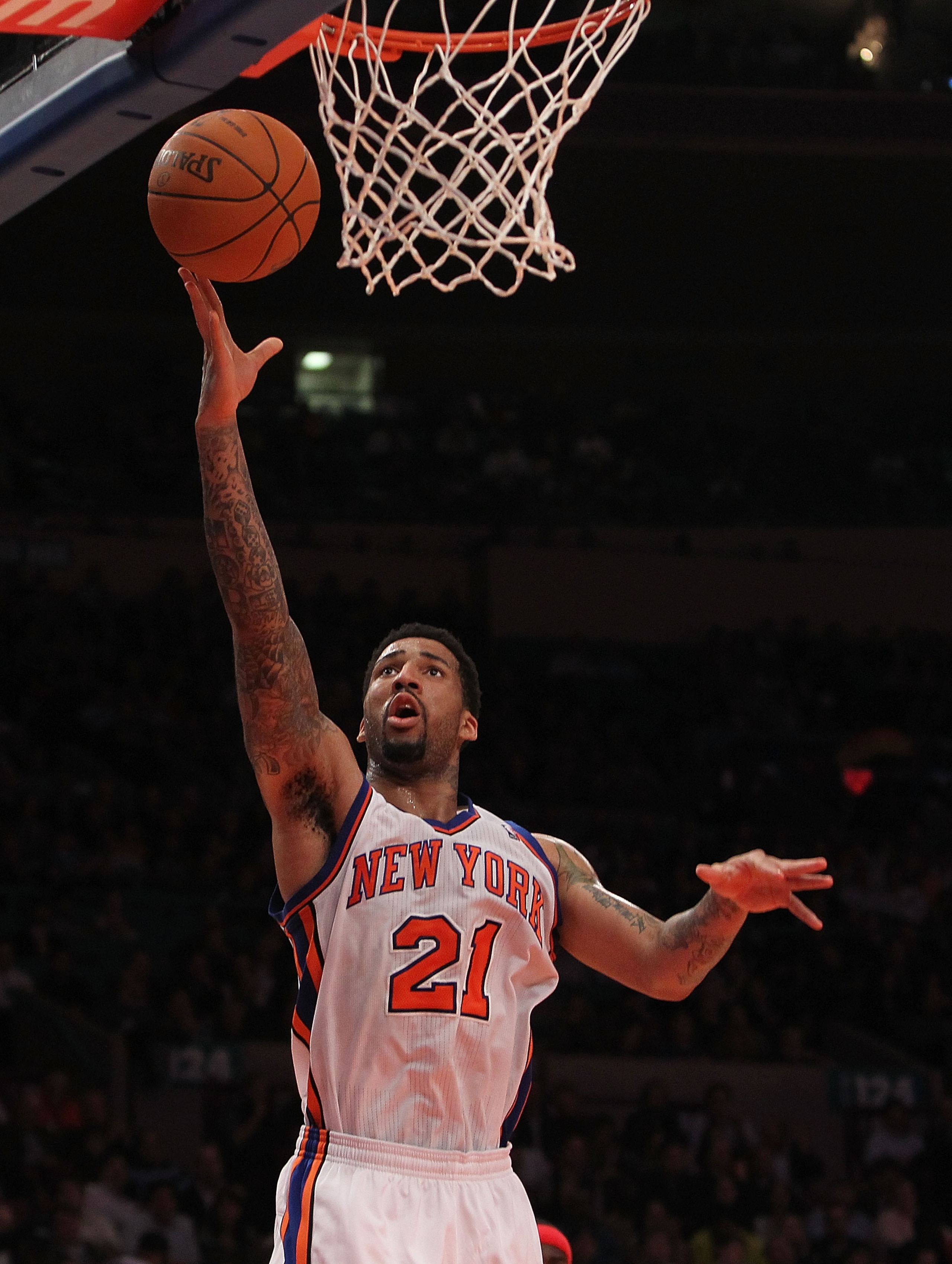 NEW YORK, NY - NOVEMBER 30:  Wilson Chandler #21 of the New York Knicks lays the ball up against the New Jersey Nets on November 30, 2010 at Madison Square Garden in New York City. NOTE TO USER: User expressly acknowledges and agrees that, by downloading