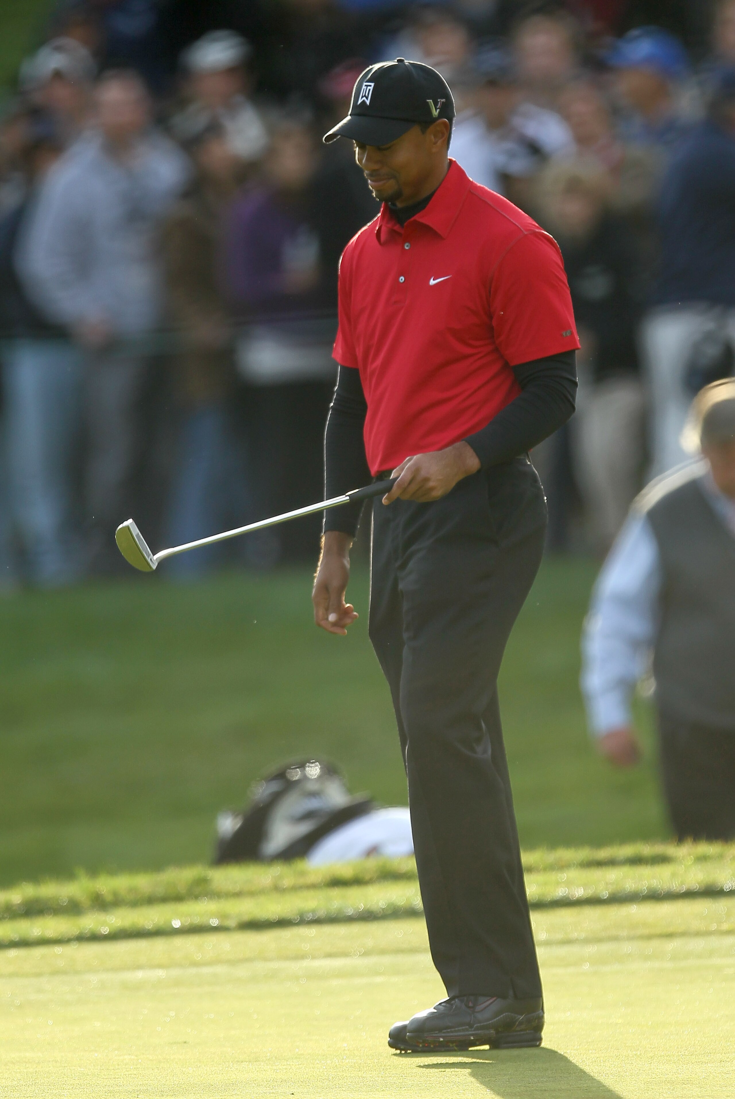 THOUSAND OAKS, CA - DECEMBER 05:  Tiger Woods reacts as his birdie putt attempt misses on the first playoff hole during the final round of the Chevron World Challenge at Sherwood Country Club on December 5, 2010 in Thousand Oaks, California. Graeme McDowe