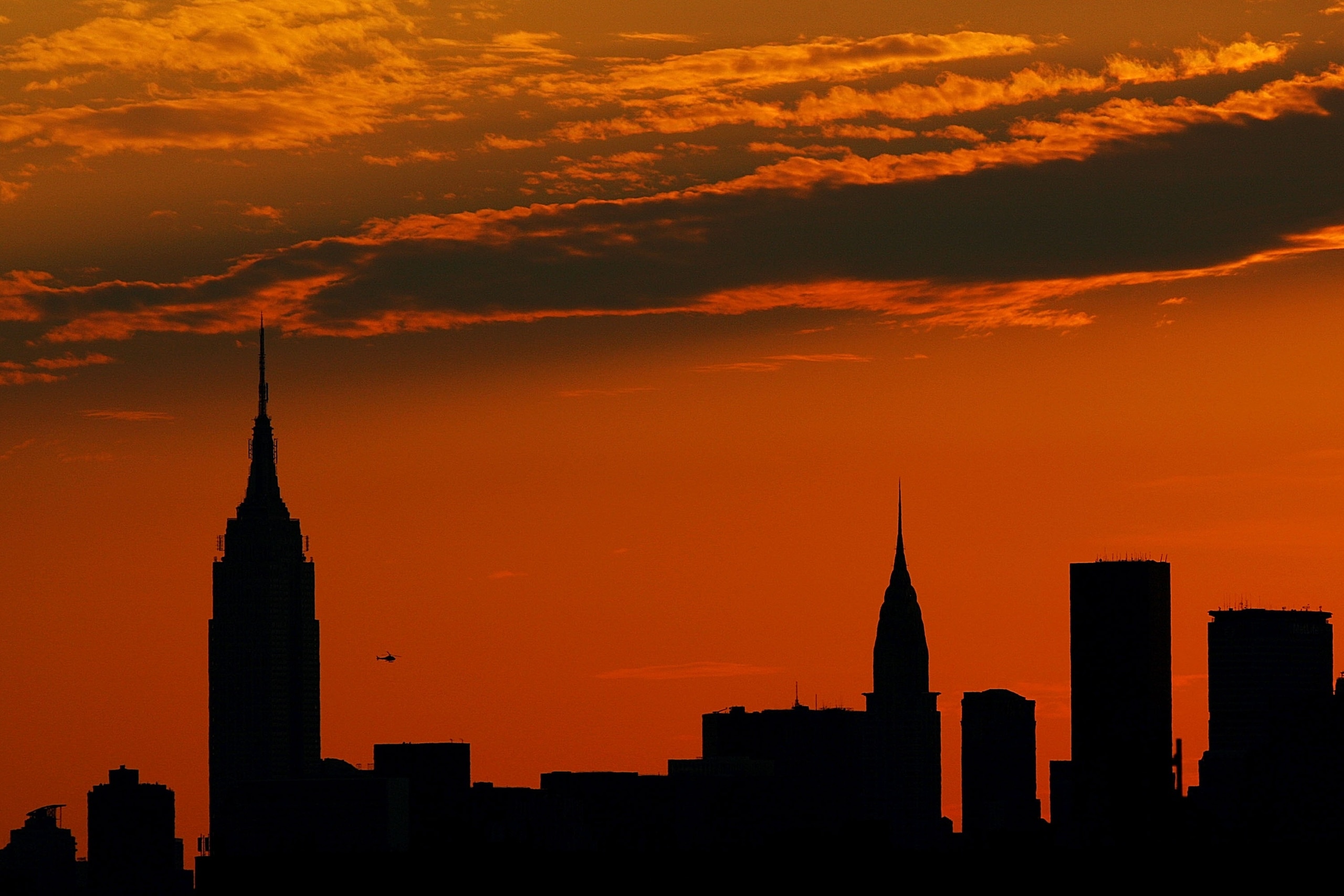 NEW YORK - SEPTEMBER 4:  The Manhattan skyline is seen from Arthur Ashe Stadium during sunset on day nine of the 2007 U.S. Open at the Billie Jean King National Tennis Center on September 4, 2007 in the Flushing neighborhood of the Queens borough of New Y