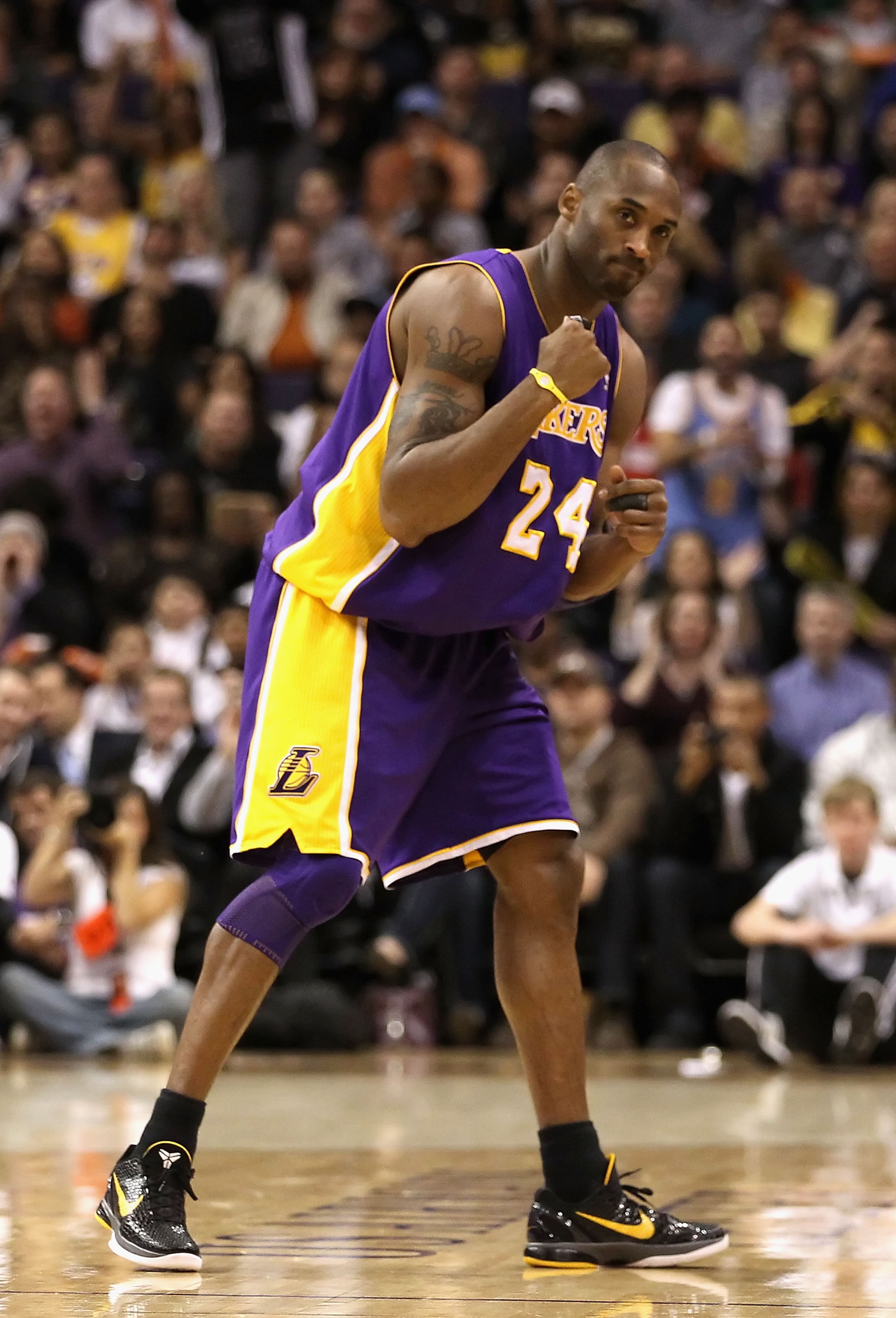 PHOENIX - JANUARY 05:  Kobe Bryant #24 of the Los Angeles Lakers pumps his fist after a fould was called against the Phoenix Suns during the NBA game at US Airways Center on December 23, 2011 in Phoenix, Arizona. NOTE TO USER: User expressly acknowledges