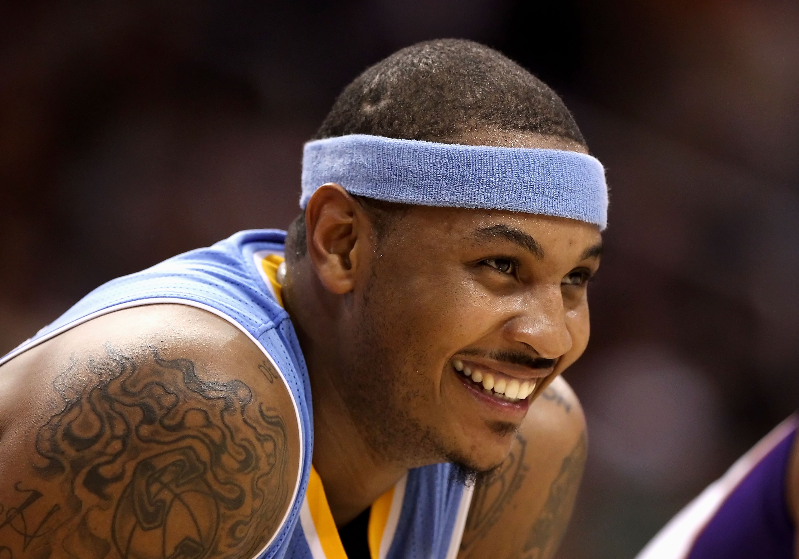 PHOENIX - NOVEMBER 15:  Carmelo Anthony #15 of the Denver Nuggets smiles during the NBA game against the Phoenix Suns at US Airways Center on November 15, 2010 in Phoenix, Arizona. NOTE TO USER: User expressly acknowledges and agrees that, by downloading 