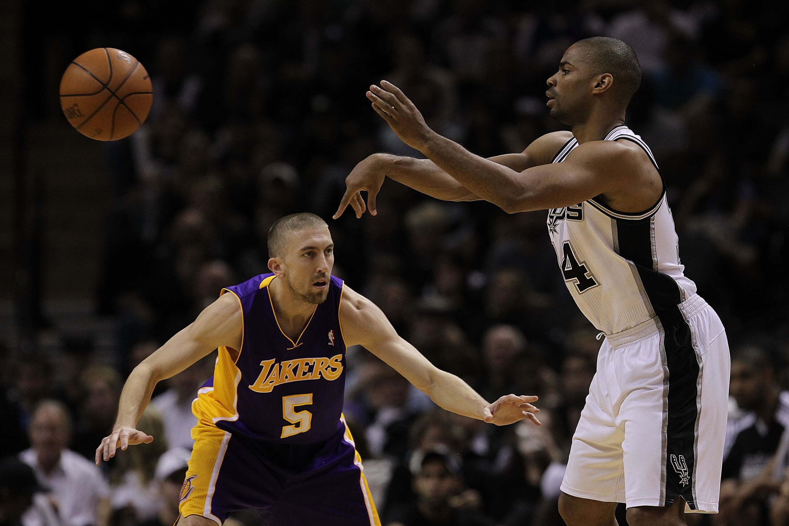SAN ANTONIO, TX - DECEMBER 28:  Guard Gary Neal #14 of the San Antonio Spurs passes the ball against Steve Blake #5 of the Los Angeles Lakers at AT&T Center on December 28, 2010 in San Antonio, Texas.  NOTE TO USER: User expressly acknowledges and agrees